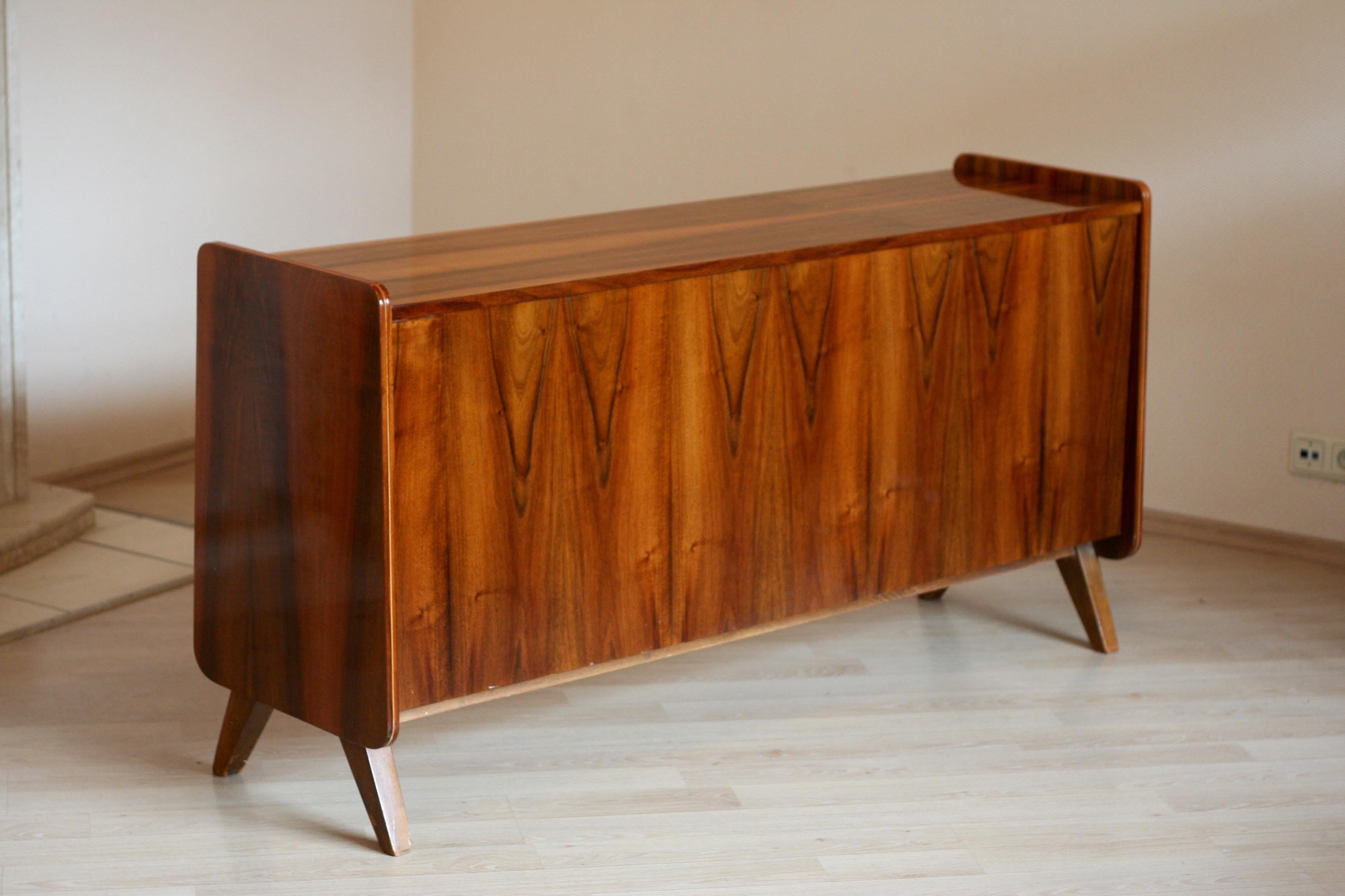 This vintage polished sideboard can be exposed both sides. Really rare piece of furniture concerning its purpose.
Wood color of the front side is a little bit lighter than the others'.

The brown paint that you can see on legs is removed.



 