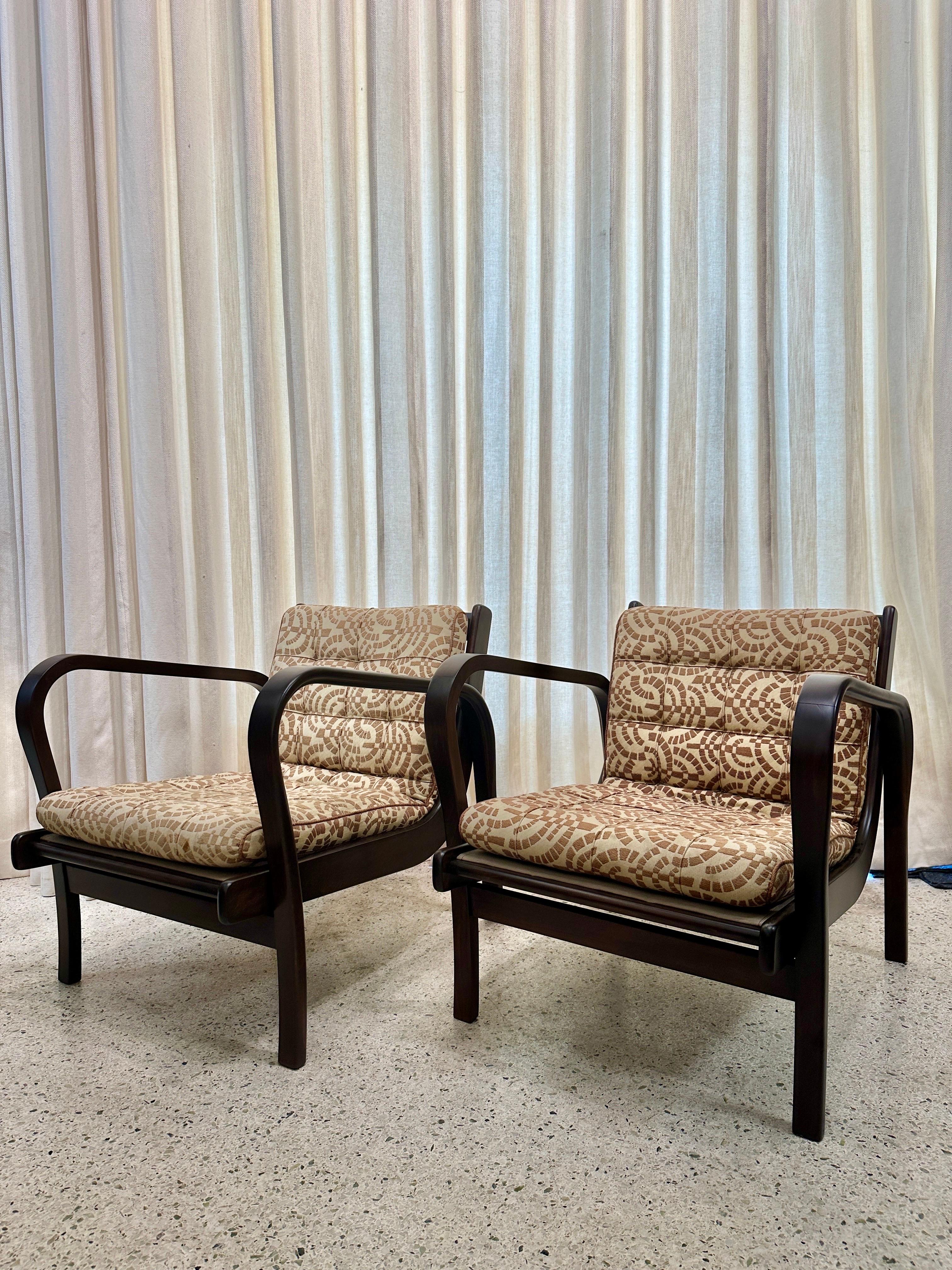 Mid-century Czechoslovakian designed bent wood armchairs.  We have left the original vintage mid-mod fabric which is very cool and with no tears, minor fading from age and use.  The seat cushions can be easily reupholstered upon request for