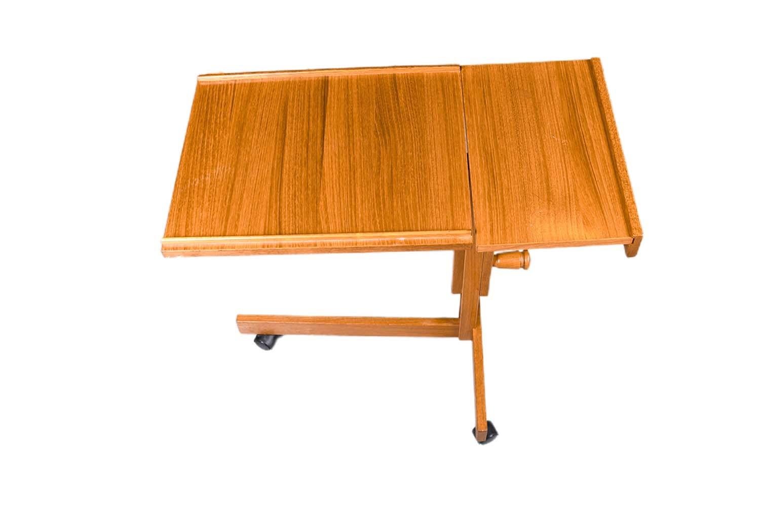 This is a very nice, Danish, Mid-Century Modern, teak and adjustable, computer, folding, music, laptop, reading, rolling tray table 1960s made in Denmark. Features dual action with two teak trays, the larger rectangular tilting, rotating tray