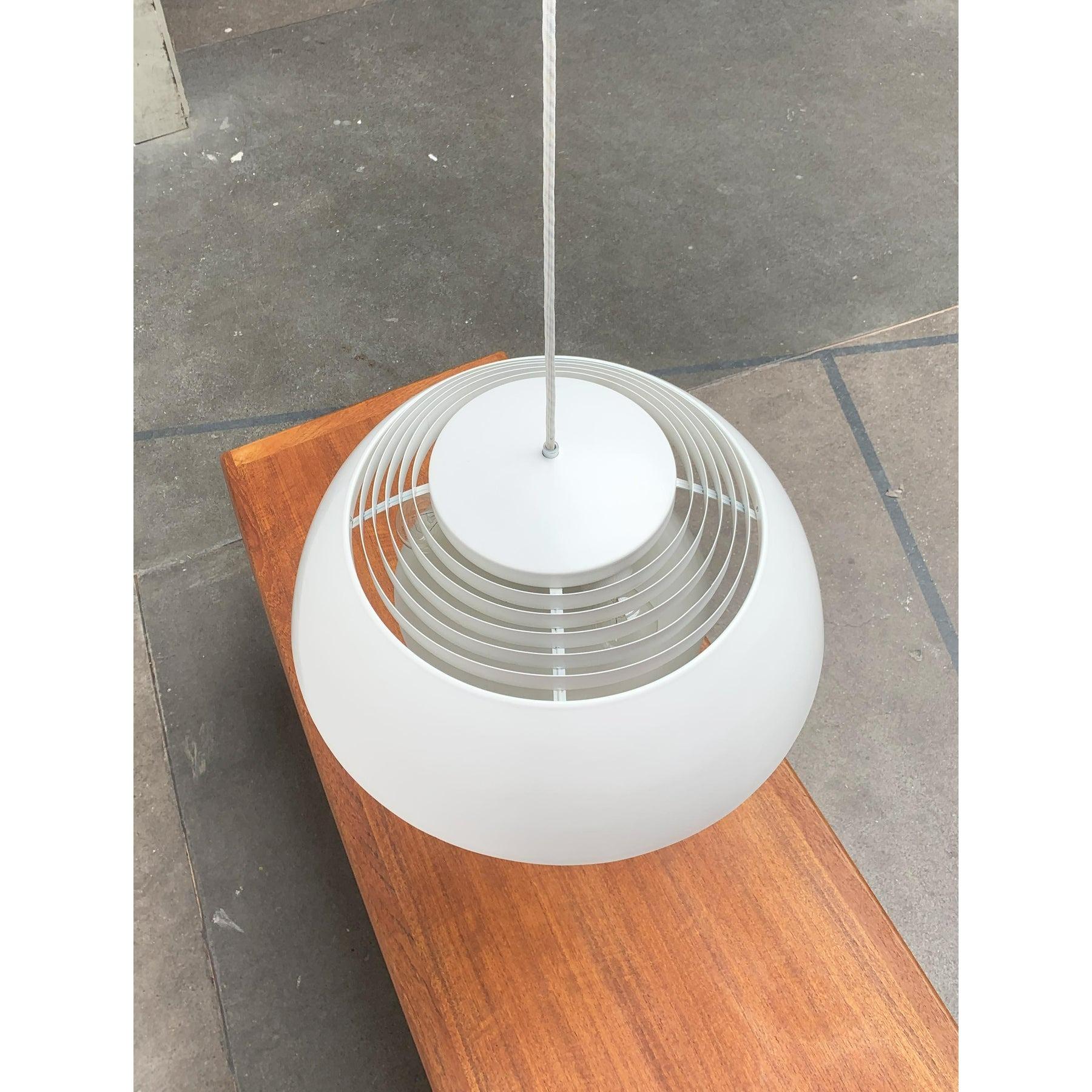 The aj royal 500 pendant lamp by the danish manufacturer louis poulsen after a design by the architect and designer arne jacobsen from the early 60s.

A timeless design classic by poulsen. Particularly striking is the simple hemispherical shape of