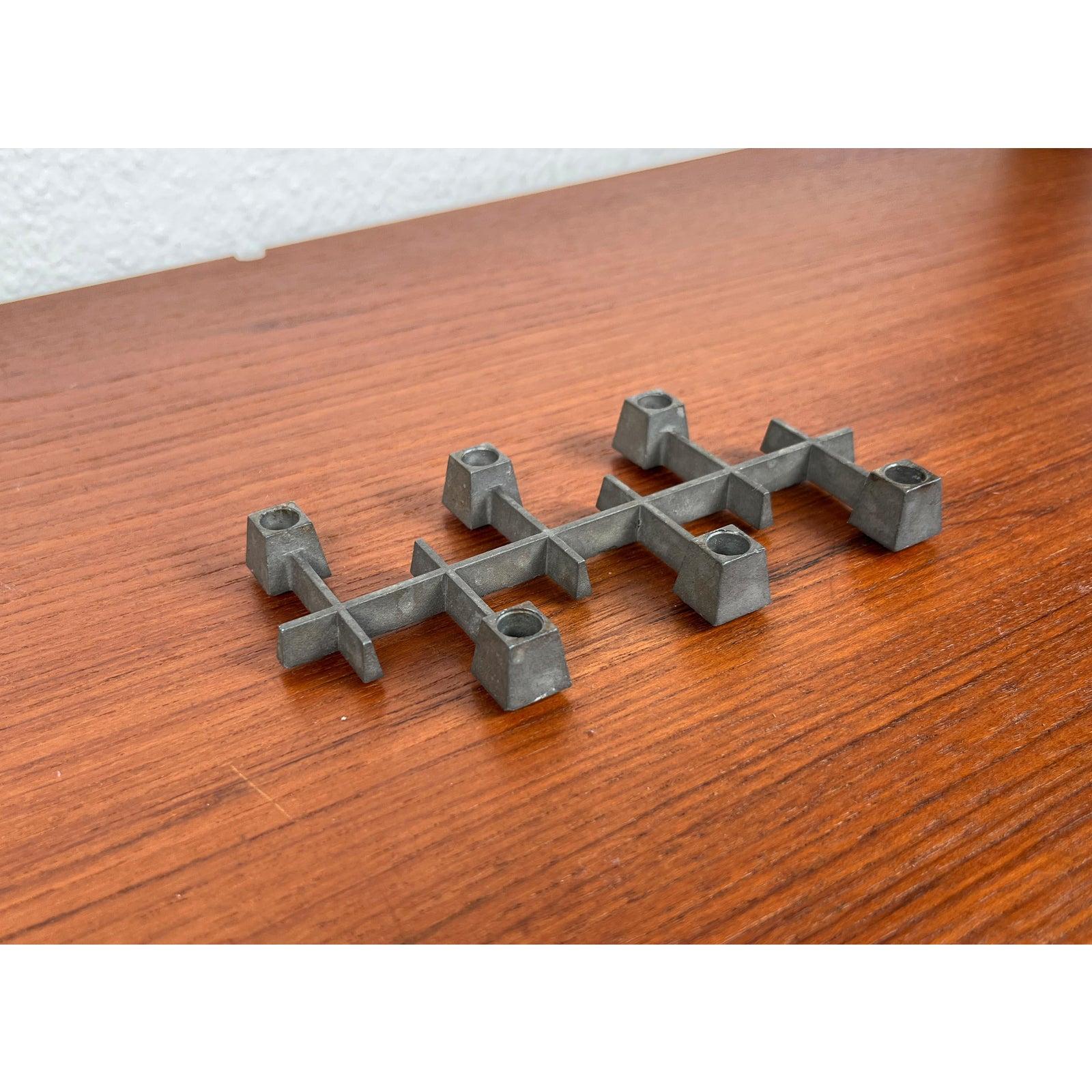 Mid-Century Danish Brutalist Cast Iron Candleholder by Jens H. Quistgaard for Paro, 1960s, in Very Good conditions. Designed 1960 to 1969 This piece has an attribution mark.

Additional information:
Materials: Metal
Color: Gray
Styles: Brutalist,