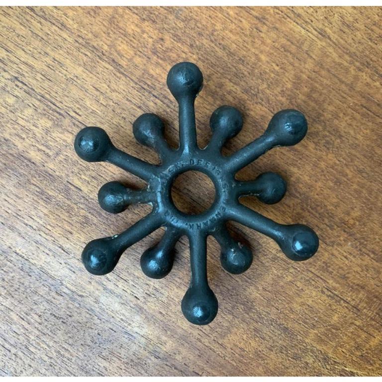 Mid-Century Danish Brutalist Cast Iron Candleholder by Jens H. Quistgaard, in Very Good conditions. Designed 1960 to 1969 This piece has an attribution mark.

Additional information:
Materials: Metal
Color: Black
Styles: Brutalist, Mid-Century
