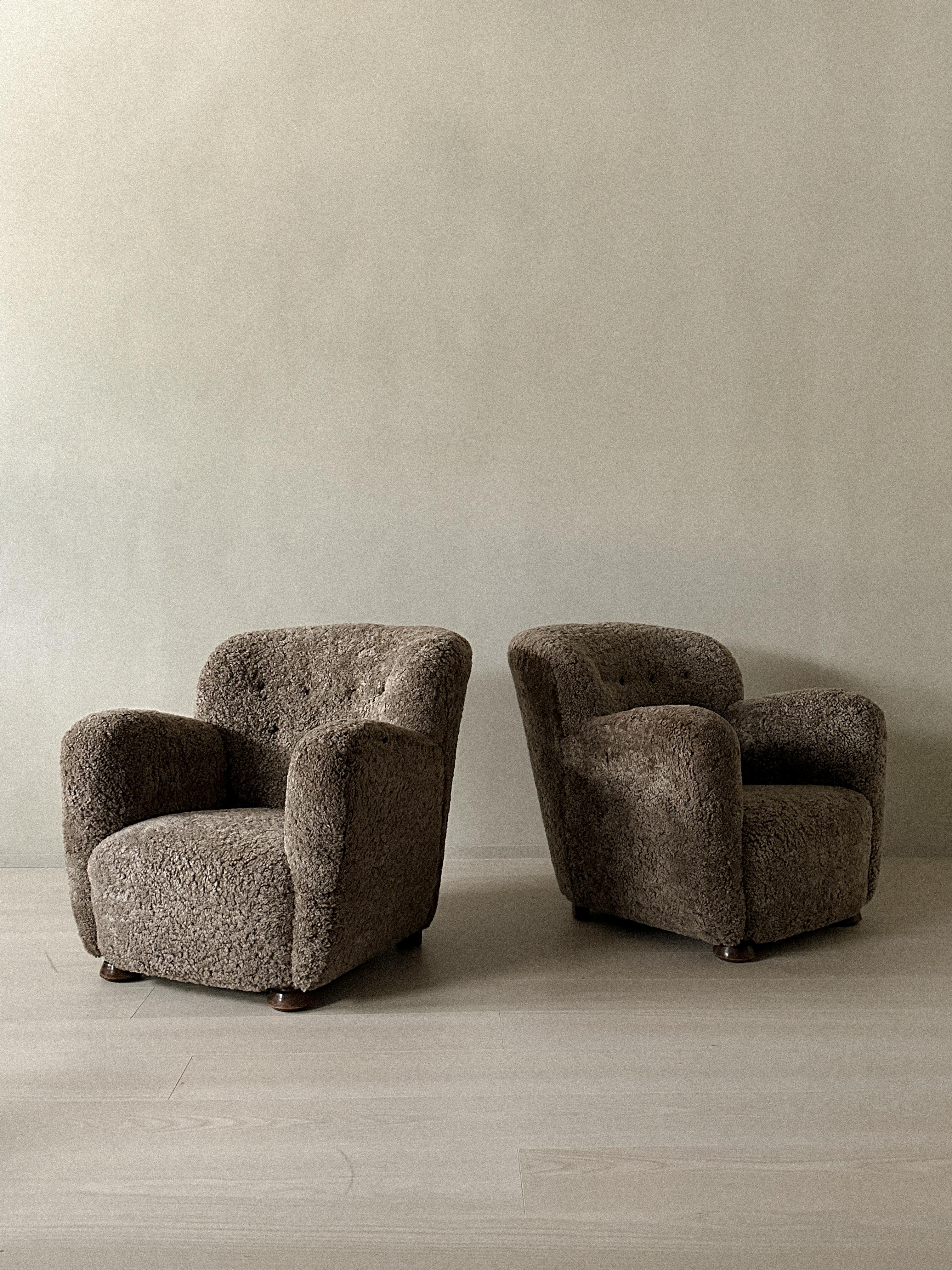 The practical and comfortable designs of Danish cabinetmakers defined mid-20th century modern seating. The Danish Cabinetmakers focused on minimalist design executed by expertly skilled craftsmen. These chairs are newly reupholstered in premium