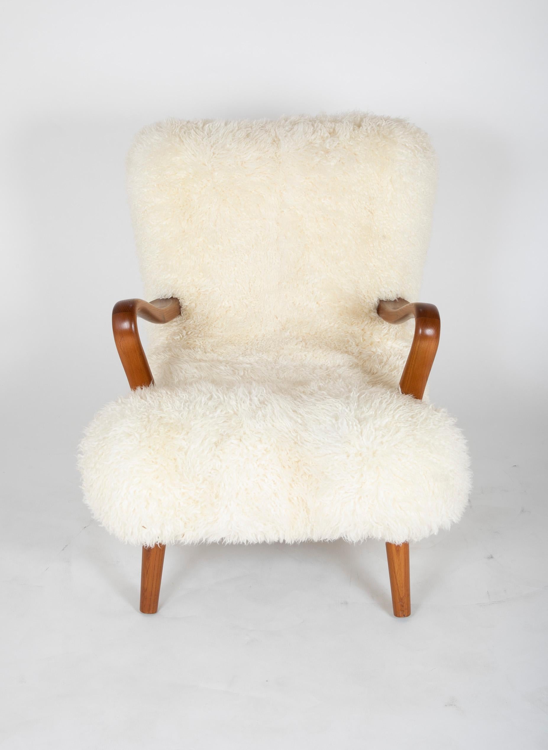 Mid-Century Modern Midcentury Danish Chair of Elm Wood and Sheepskin in the Style of Arctander