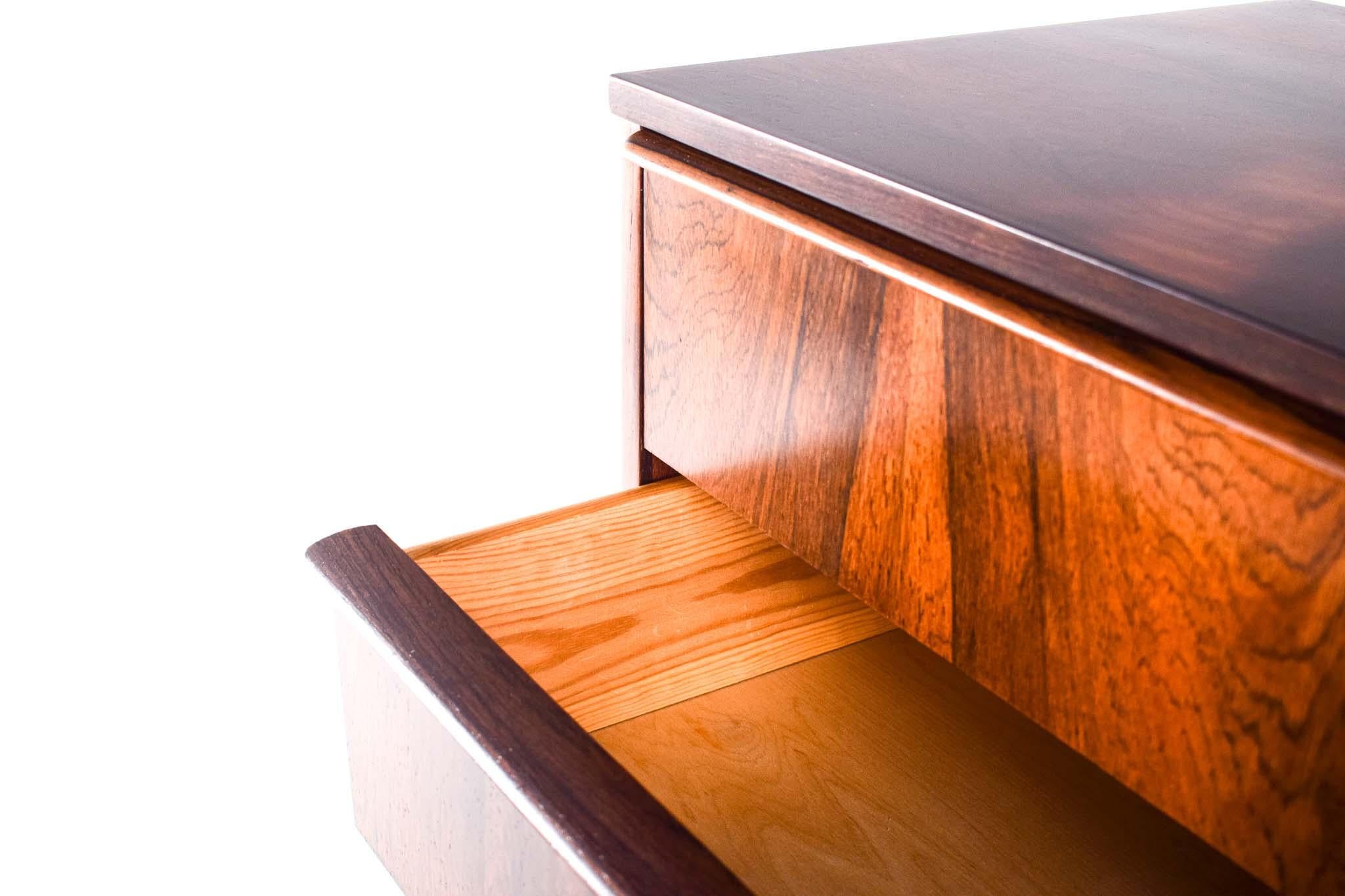 This exquisite mid-century modern chest of drawers embodies the quintessential elements of Scandinavian design, characterized by its simplicity, functionality, and timeless elegance. Crafted from high-quality materials, this chest showcases the