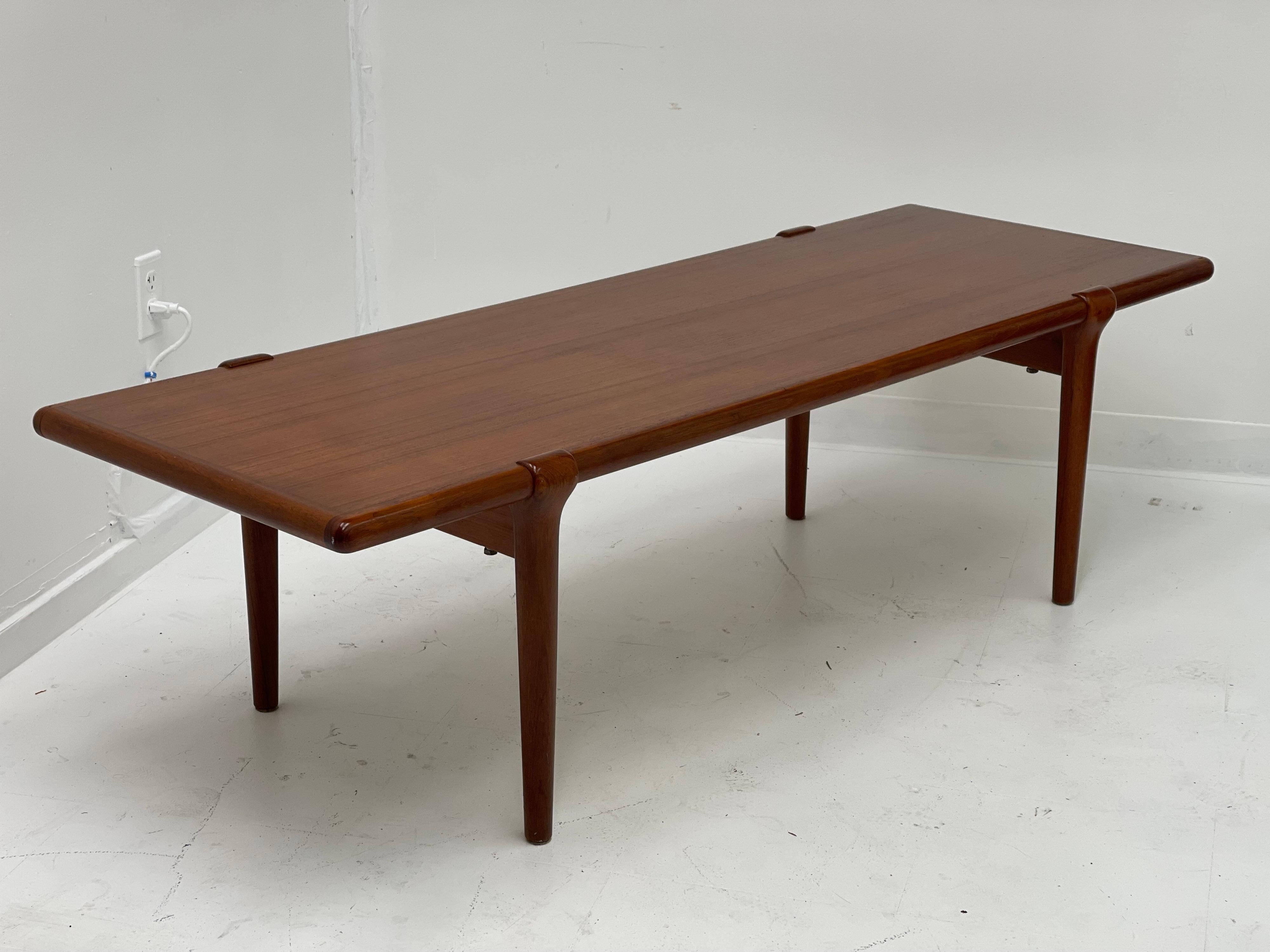 Unique and classic Danish modern coffee table styled after Niels Moller.