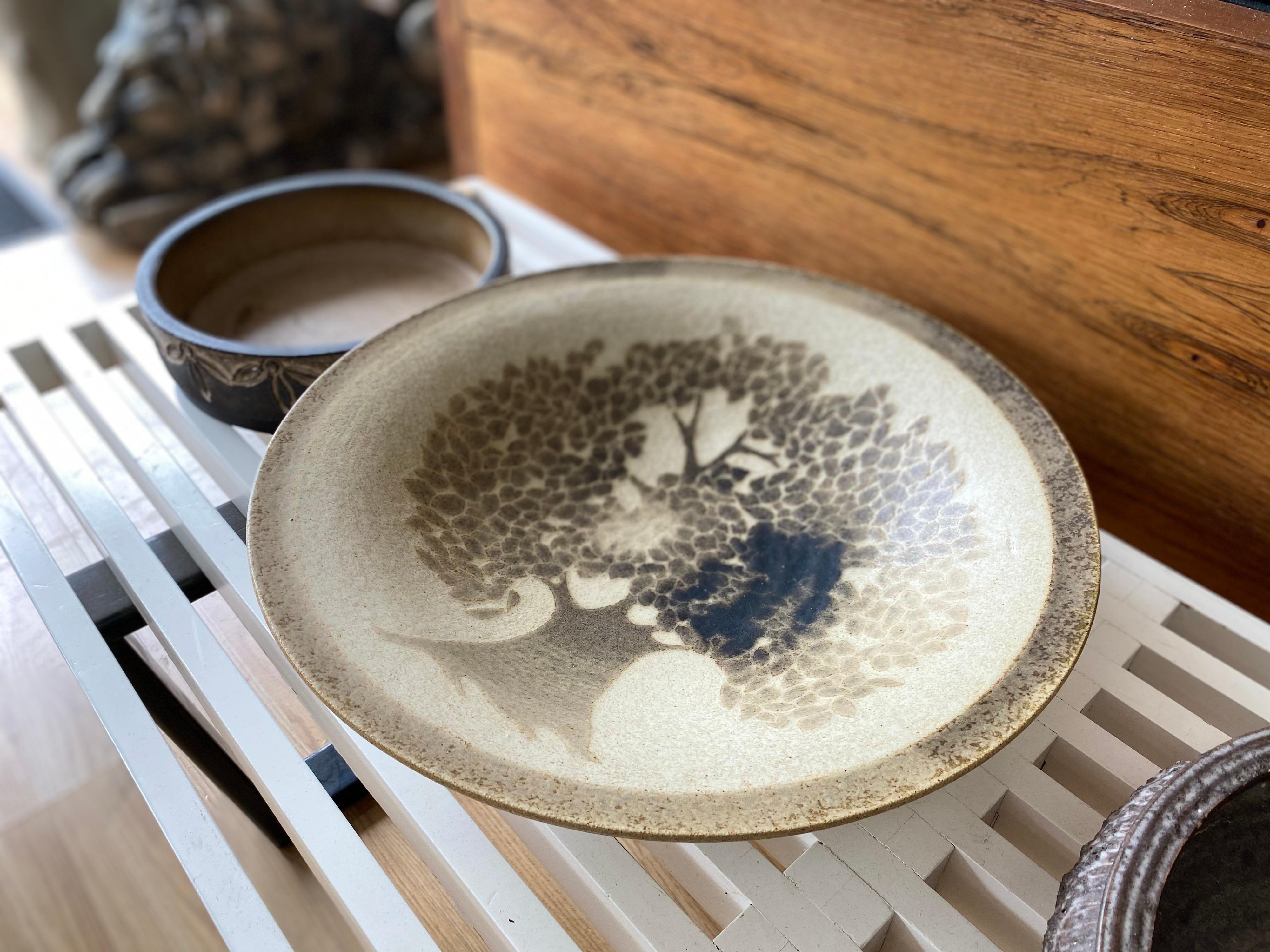 Beautiful vintage decorative ceramic bowl made in Denmark featuring 'tree of life' can be hung easily or sit atop a flat surface.