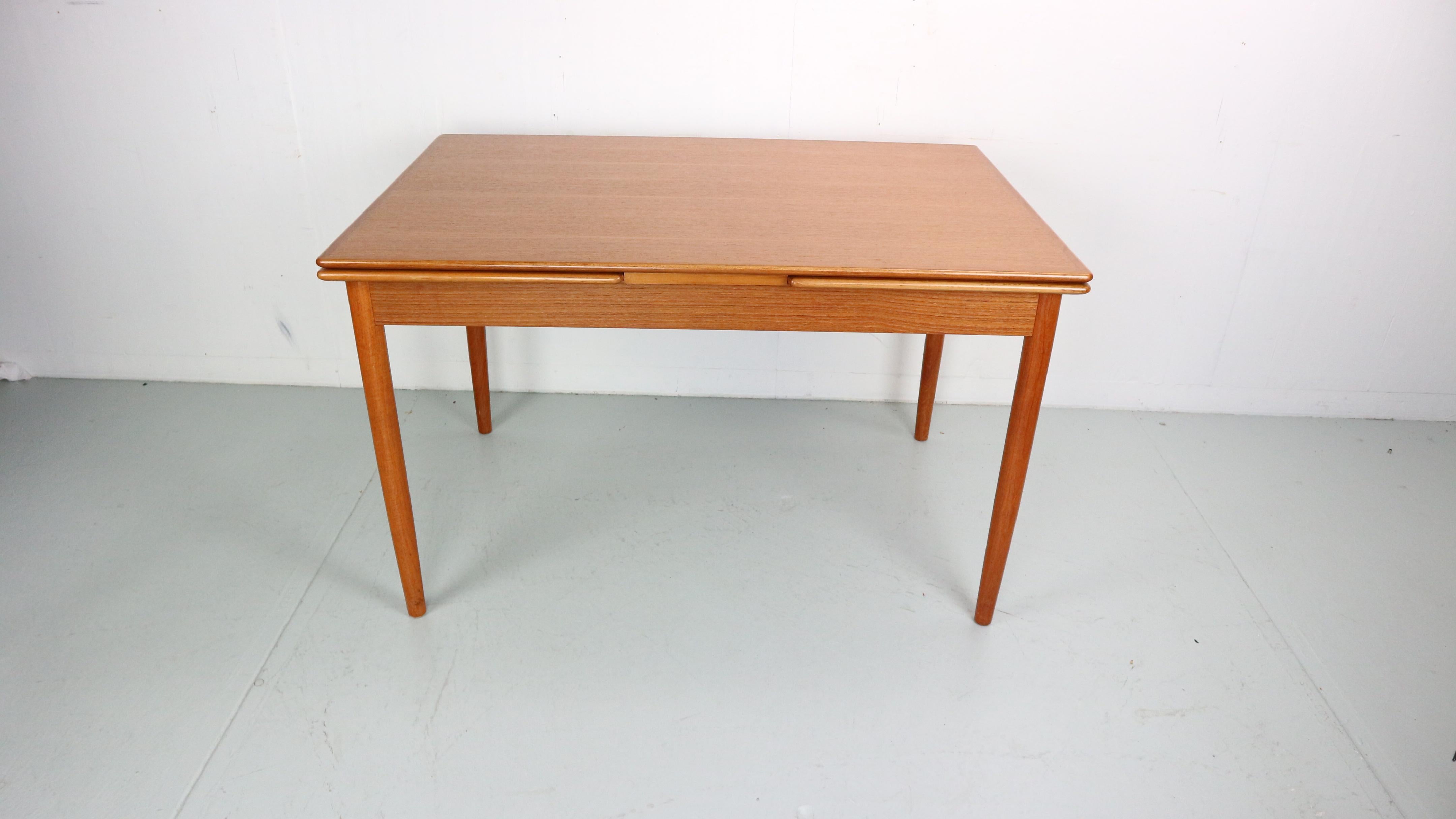 Mid-century period design extendable dinning table made from teak wood. Has beautiful wood pattern and elegant legs.
Made in Denmark, 1960s.
tabletop Dimensions: 124cm - Extendable 223cm.
 
The legs can be unscrewed for a shipping.
Extendable two