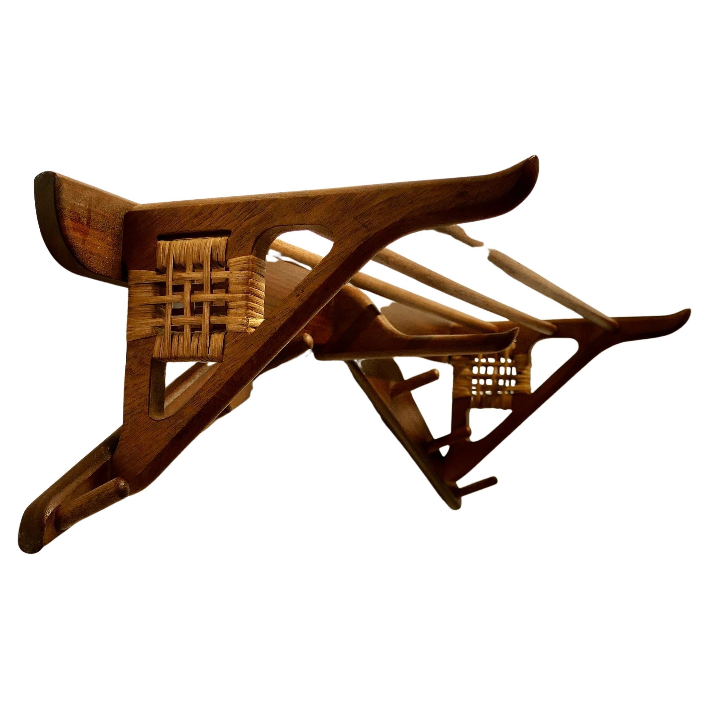 Midcentury Danish Design Solid Teak Hall Rack Coat Hanger


A very stylish Scandinavian Danish Design 60s Retro shelved coat and hat rack 
In very good condition, the rack has 6 short hooks and a along one in the centre beneath the shelf and it has