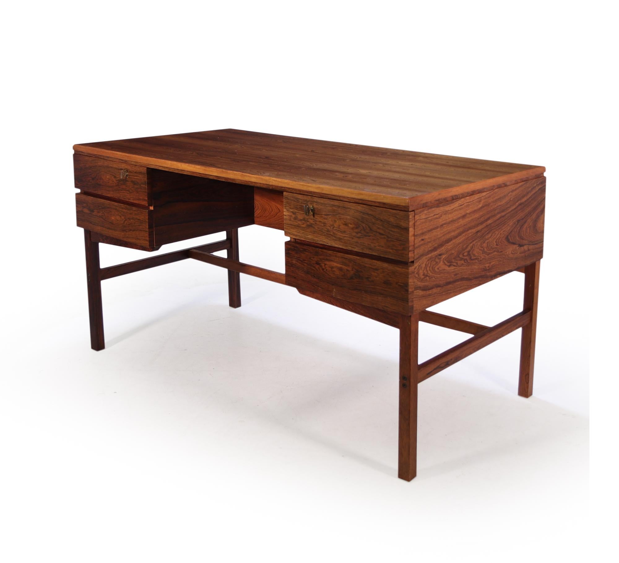 Mid-Century Modern freestanding Desk produced in Denmark in the 1960’s the desk has four drawers with the top two being lockable, with two keys supplied, to the back is a three sectional open bookcase, the desk is in excellent condition throughout