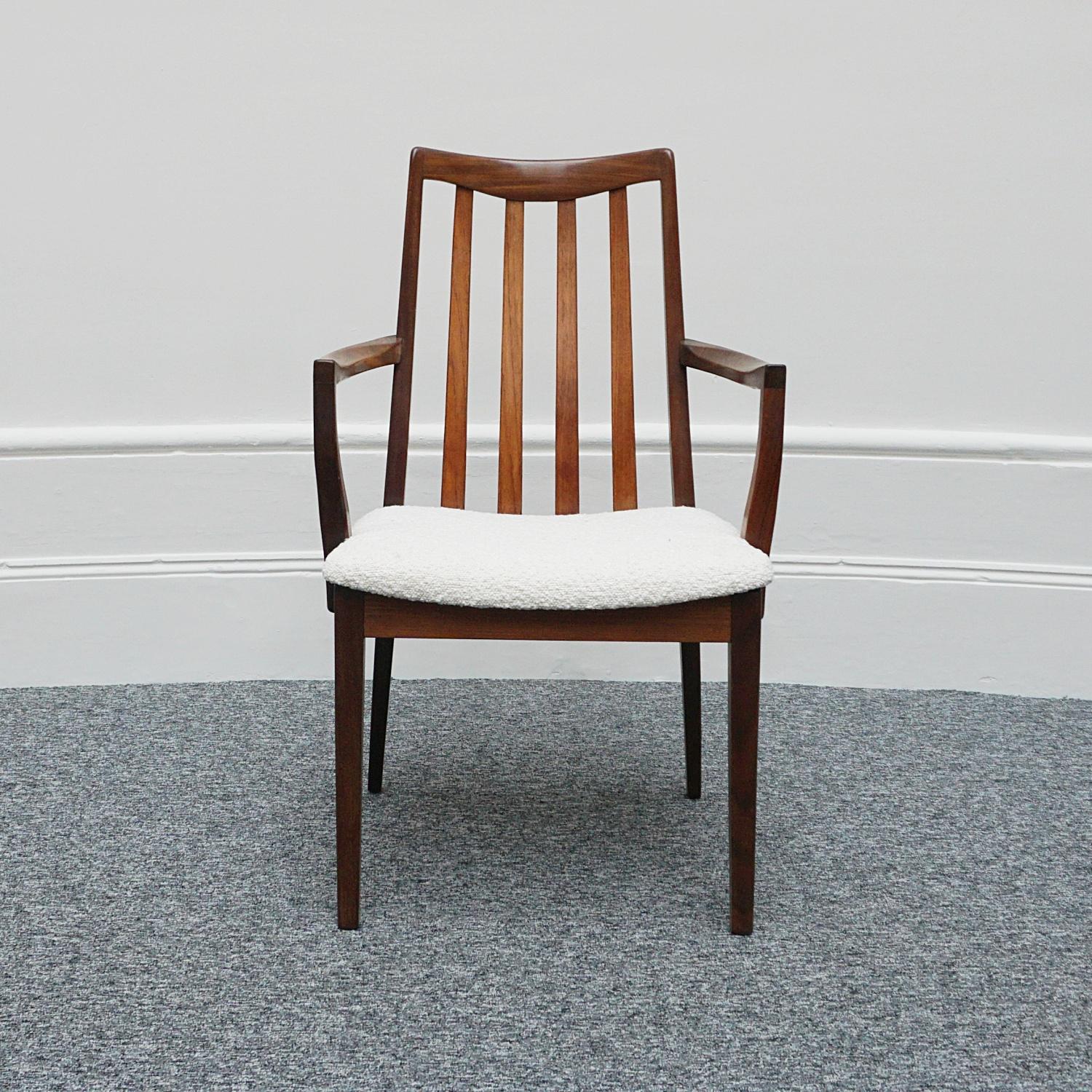 A mid-century desk chair. Rosewood, upholstered in white Bouclé. 

Dimensions: H 90cm W 57cm D 44cm Seat H 44cm W 49cm D 44cm Arm H 65cm 

Origin: Danish

Date: Circa 1960.