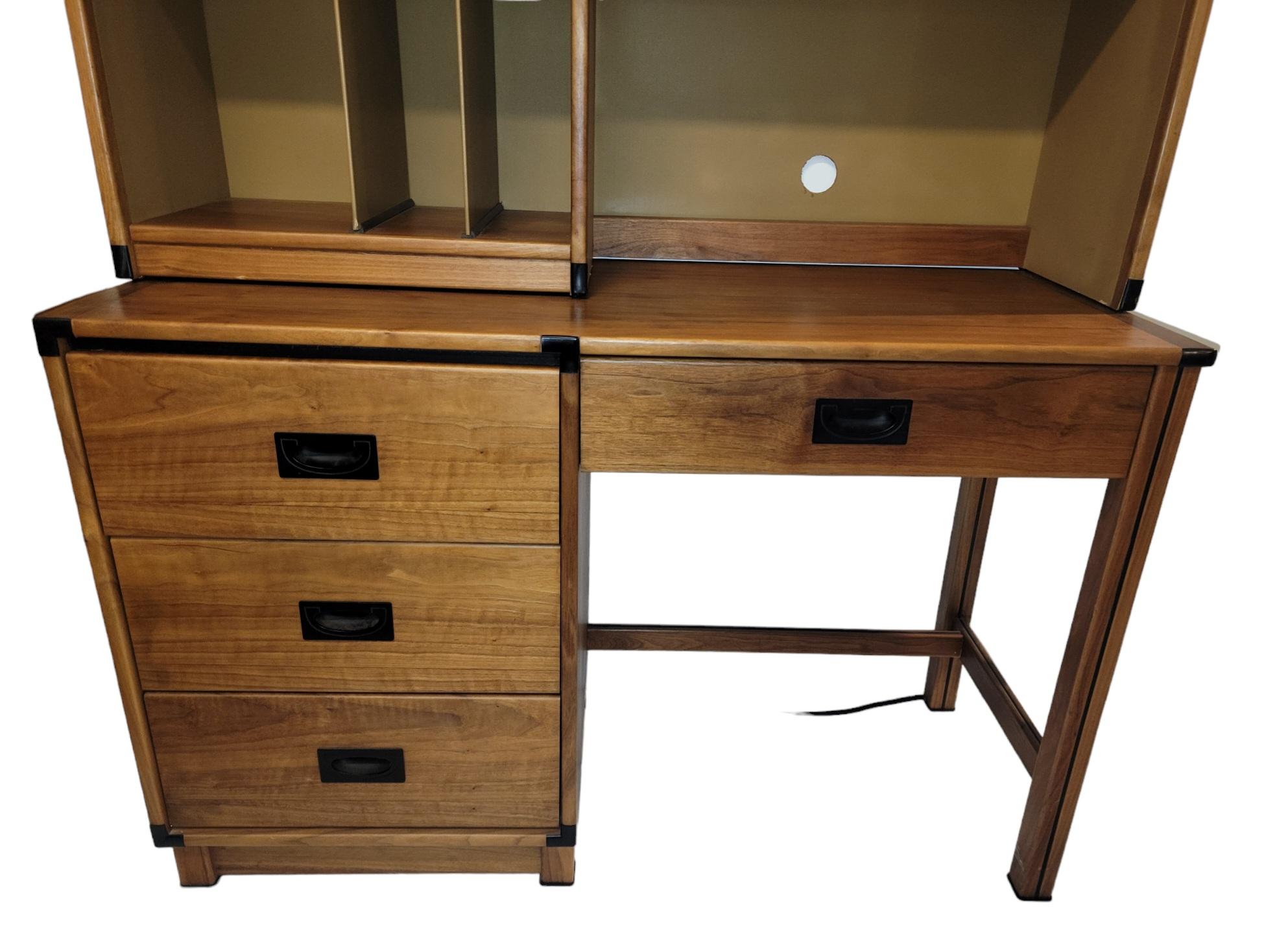 Mid Century Drexel Danish Desk with shelves. This desk set has a lot to offer is the foot print it provides. The desk has a great area for work space and offers plenty of shelf space to keep you space organized. This desk set has a small 2 door