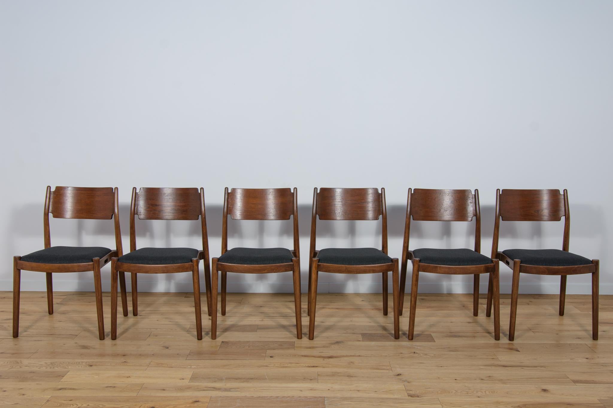 
The set of six chairs was produced in Denmark in the 1960s. The chairs were made of beech wood. The furniture has been thoroughly renovated, cleaned of old coatings, stained with rosewood stain, and finished with a strong semi-matt varnish.
