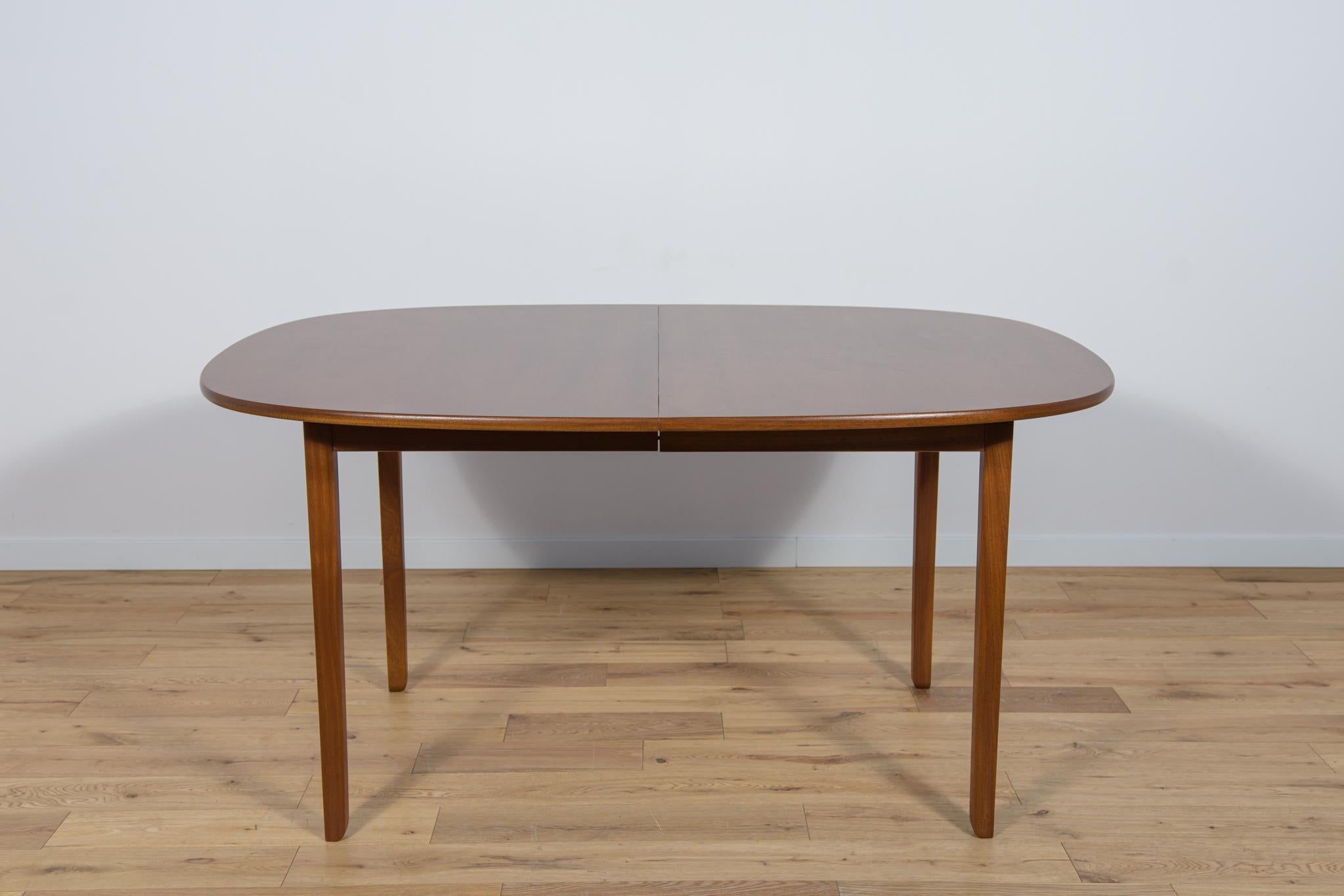 The Table Rungstedlund was designed by Ole Wanscher and manufactured in the 1960s and 1970s by Poul Jeppesen in St. Heddinge in Denmark. Completely restored. The table is made of mahogany wood. The wood elements have been cleaned from the old