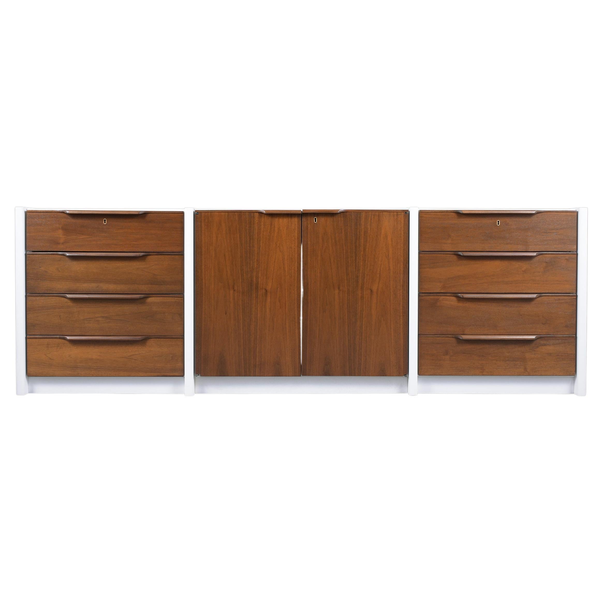 Embrace the unparalleled craftsmanship and design of the 1960s with our stunning Danish executive cabinet, a piece that truly reflects the sophistication of the era. Expertly handcrafted from rich walnut and meticulously restored by our team of