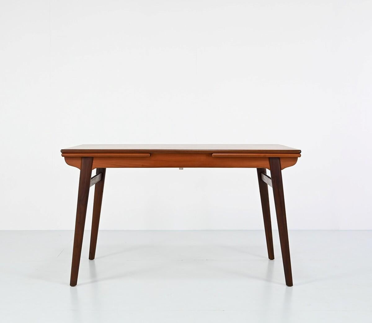Mid Century danish extendable Dining Table by Hans J. Wegner

size of the table with extension is 227x85x75.5cm