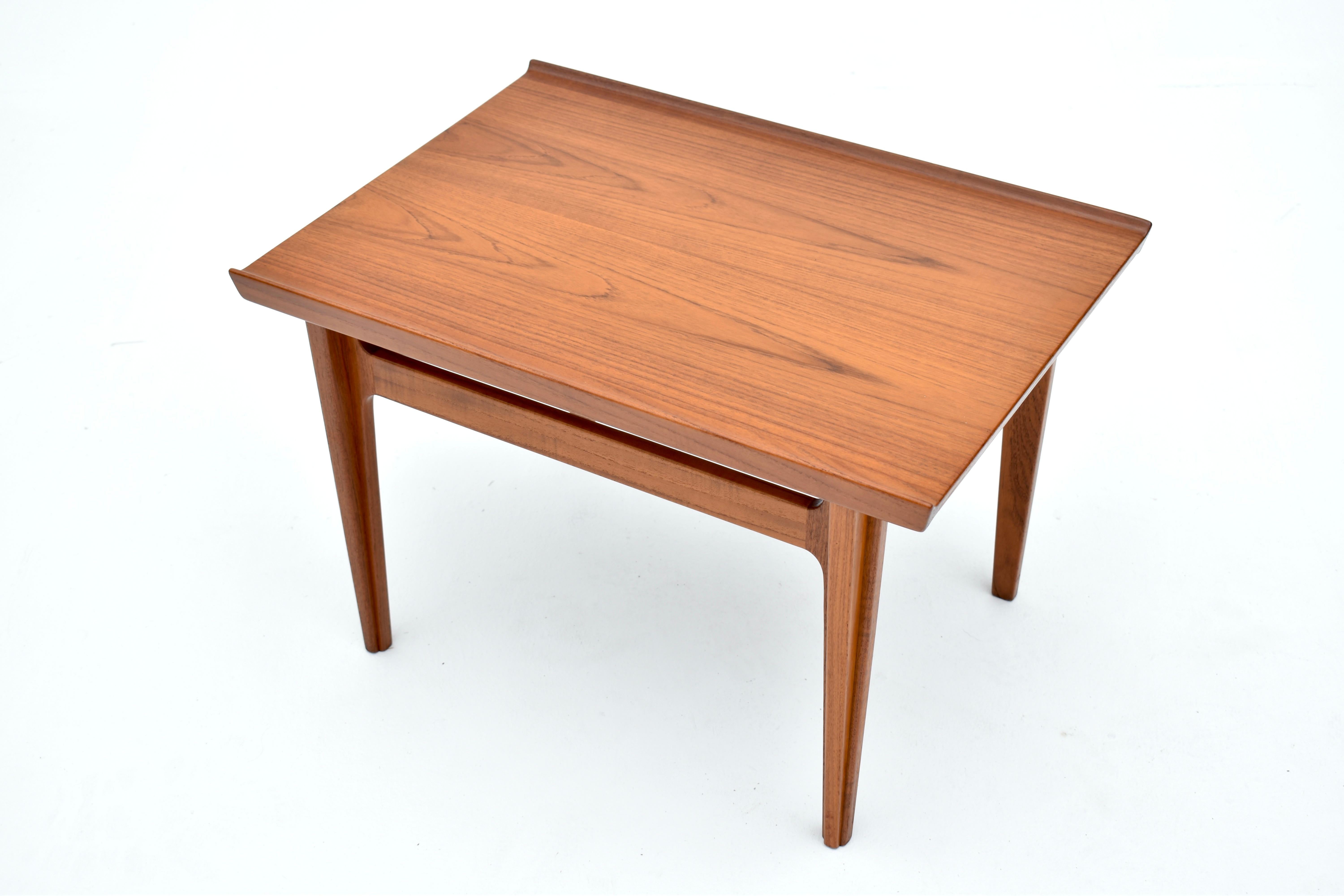 Rarely seen Teak side table designed by one of the most important designers of the Danish Modern movement, Finn Juhl.

A pair of these tables can be seen situated next to a Chieftain chair in Finn Juhl’s own home which is now open as a museum.

This