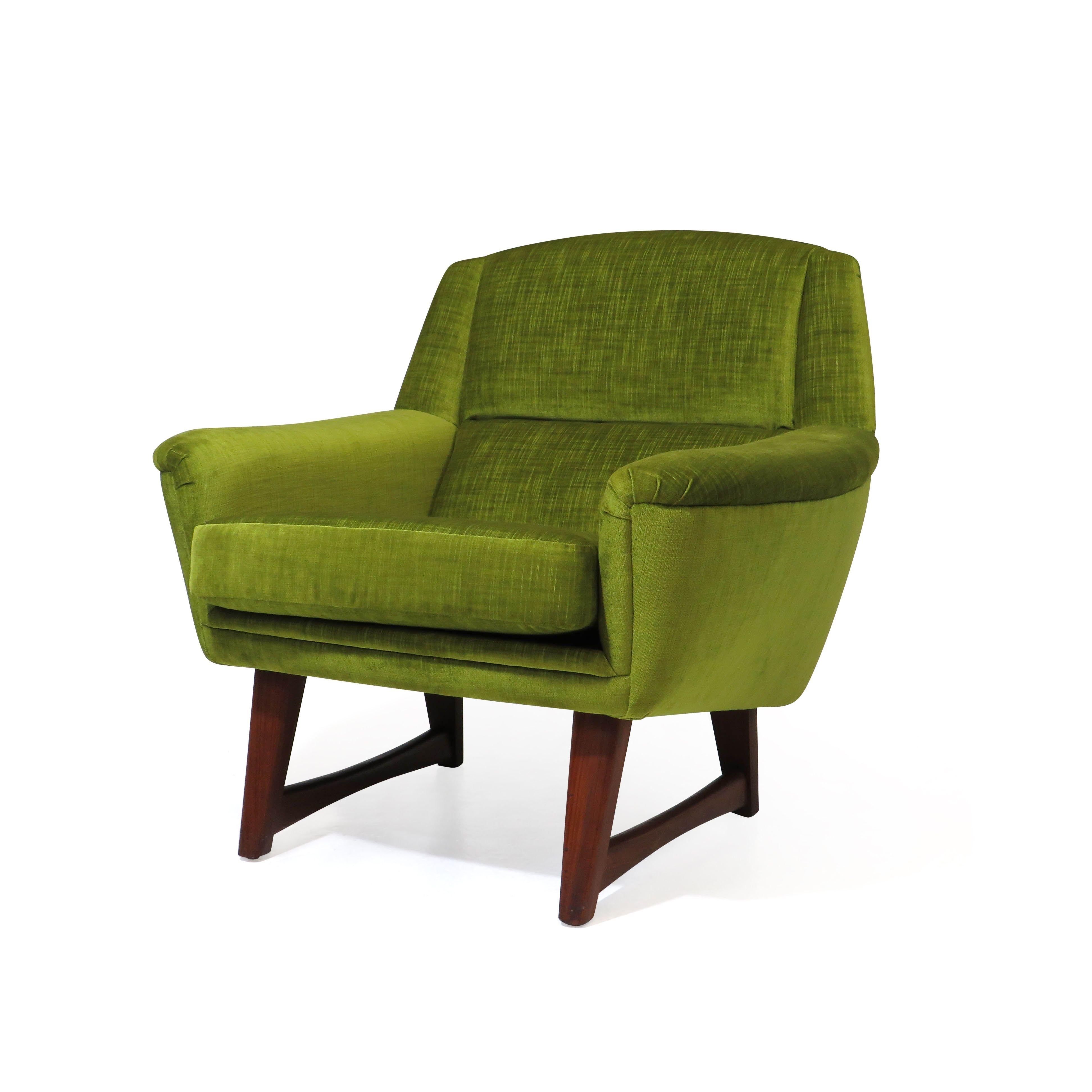 High-quality 1950's lounge chair crafted of a solid walnut frame and newly upholstered in a lime green velvet. Excellent condition.

