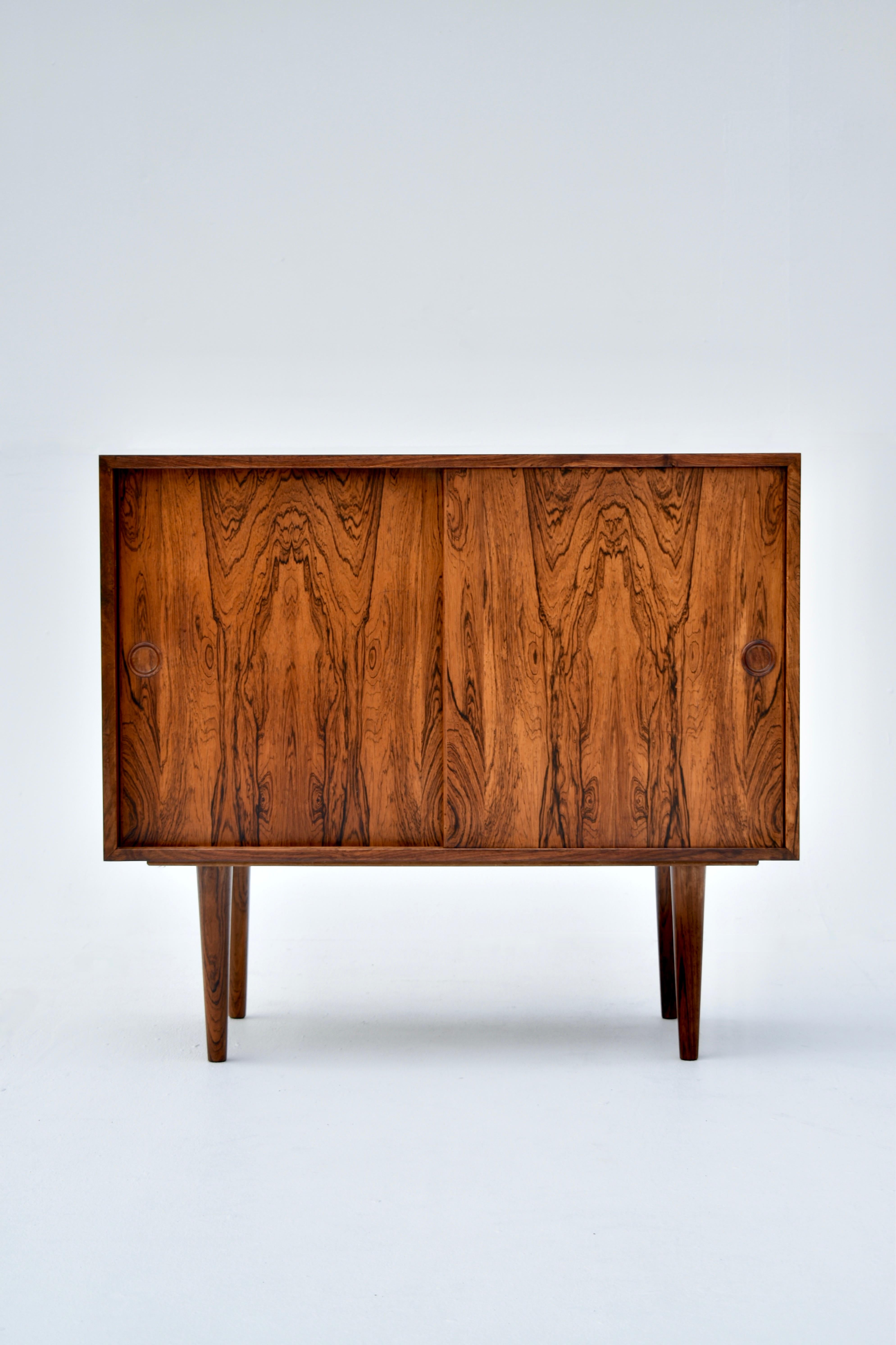 Beautiful little sideboard designed by Kai Kristiansen for Feldballes Møbelfabrik in the mid 50’s.

This particular example has the most dramatic timber grain we have seen on this design, it is absolutely stunning. The interior is also lined with