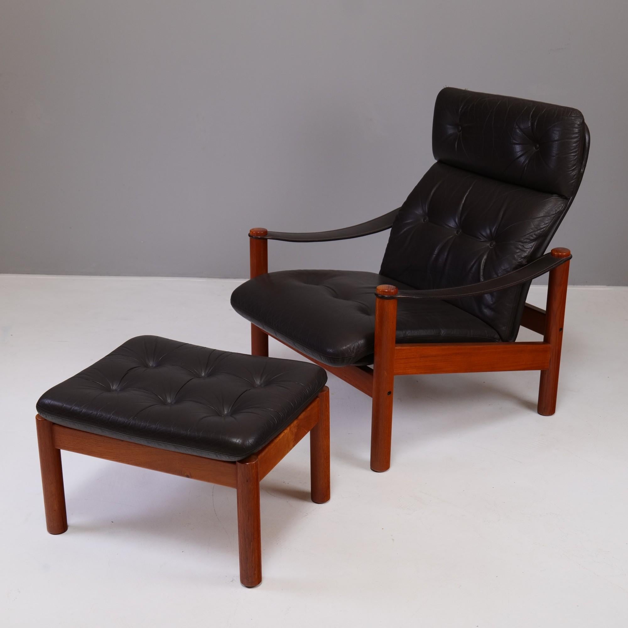 Original Danish leather lounge chair with ottomann.
 