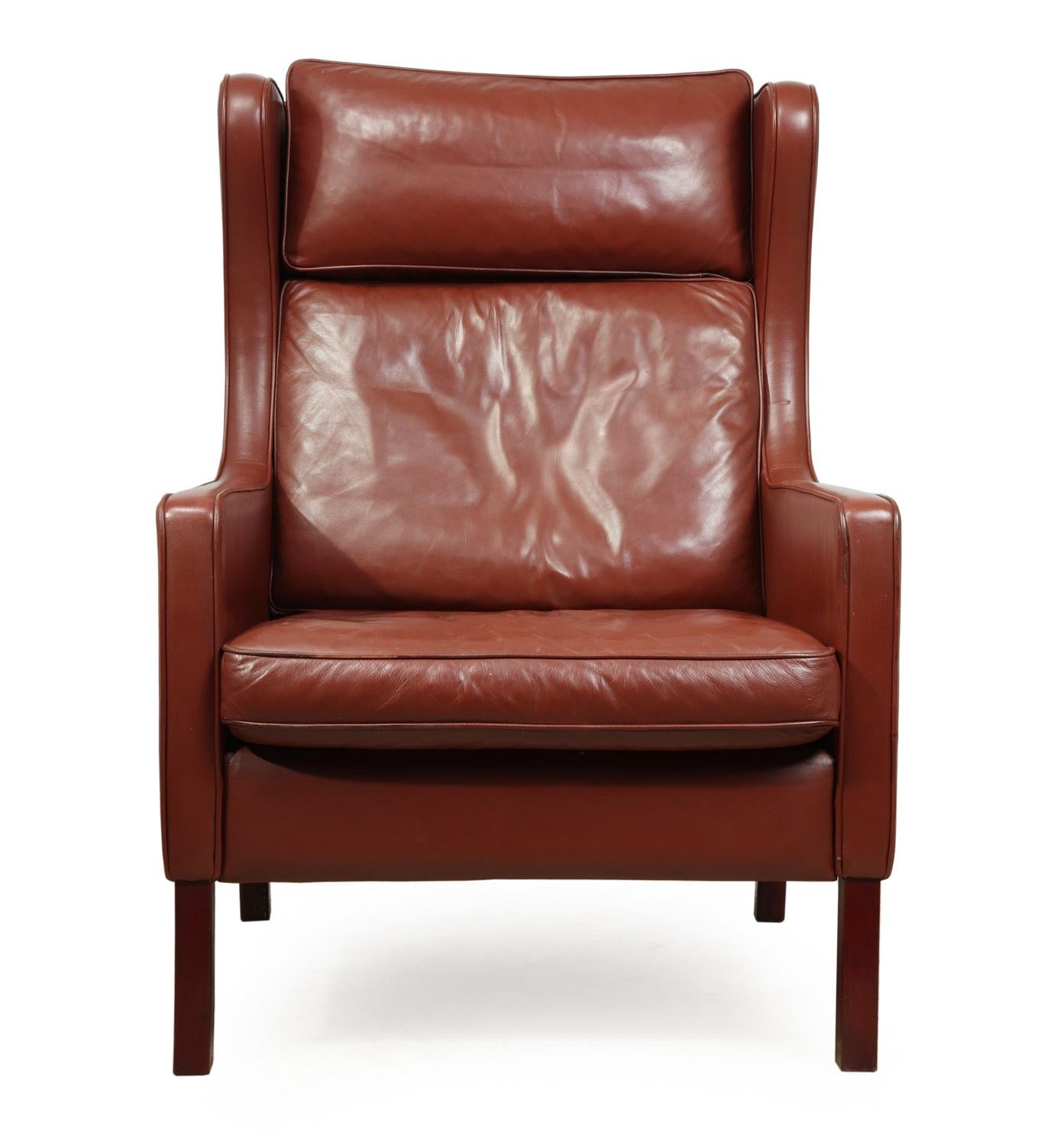 Midcentury Danish leather wing chair by Stouby, circa 1970
A good quality wing chair in tan leather by renowned Danish maker Stouby, produced in thick Hyde leather, in very good condition throughout with minimal wear

Age: 1970

Style:
