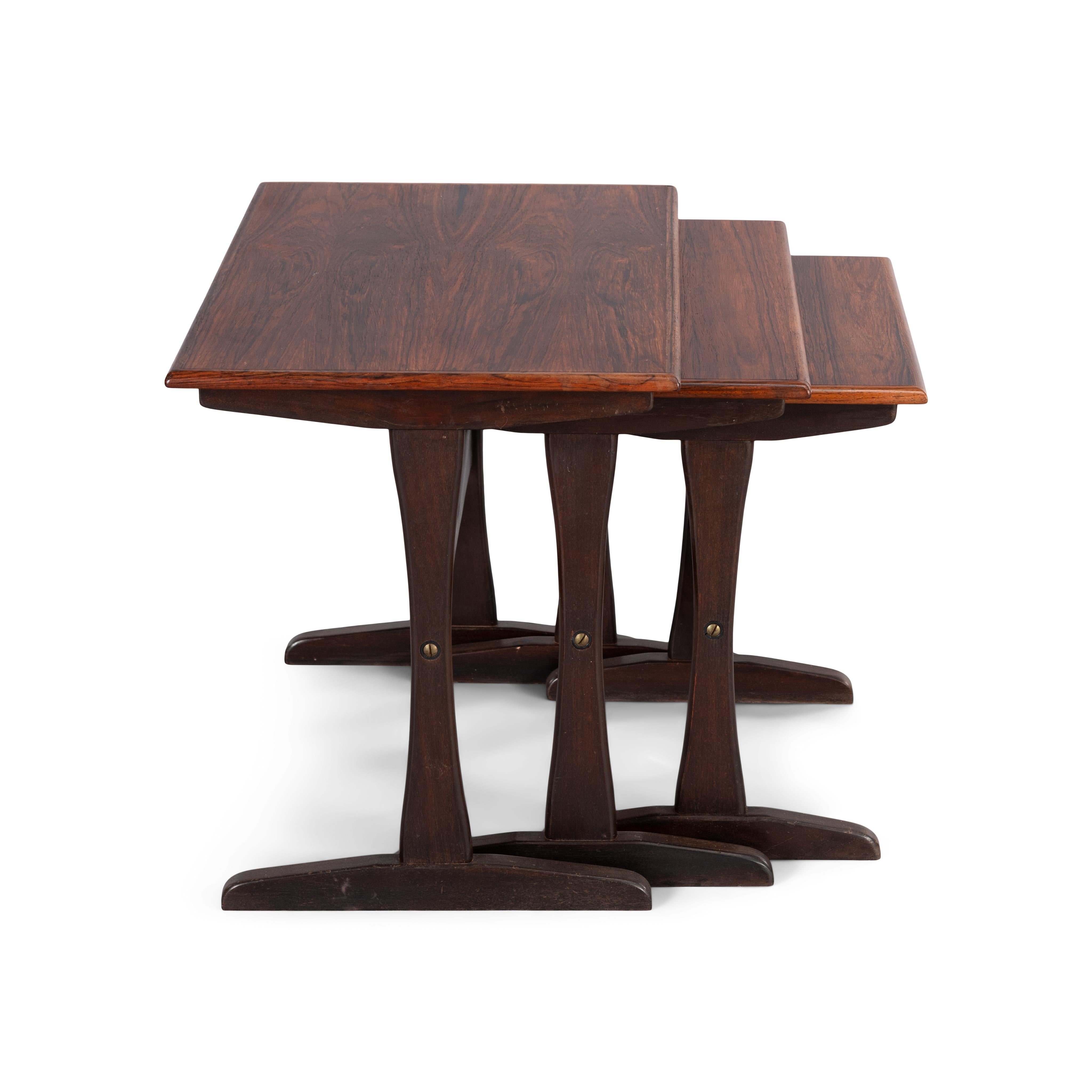 Set off mahogany side tables by Kai Kristiansen. Each table consists of a stained beech or oak base and a mahogany veneered top. The tops have been renewed with an acrylic protective coat. This has brought these nesting tables to an excellent