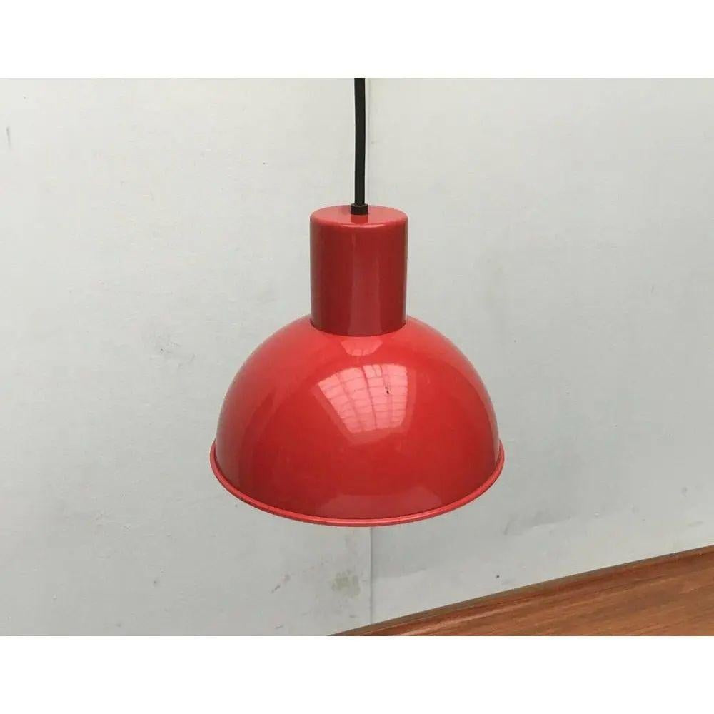 Bunker “Mini” pendulum from the Danish manufacturer Fog & Mørup after a design by Jo Hammerborg.

Simple pendant lamp in classic form and in a strong red tone. The hemispherical reflector that Hammerborg had designed is particularly striking. This