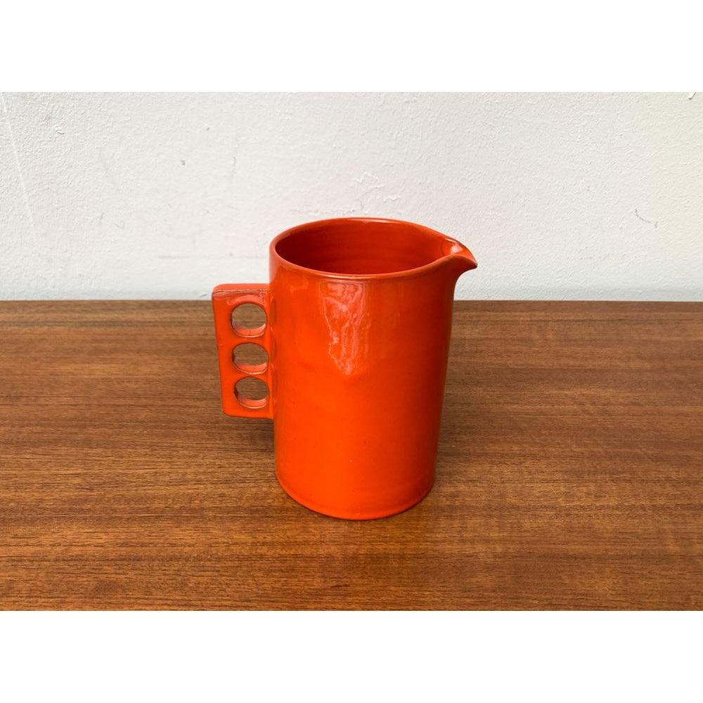 Mid-Century Danish Minimalist Carafe, 1960s, in Very Good conditions. Designed 1960 to 1969.

Additional information:
Materials: Ceramic
Styles: Mid-Century ModernMinimalist
Color: Orange
Country of Origin: Denmark
Item Type: Vintage, Antique or