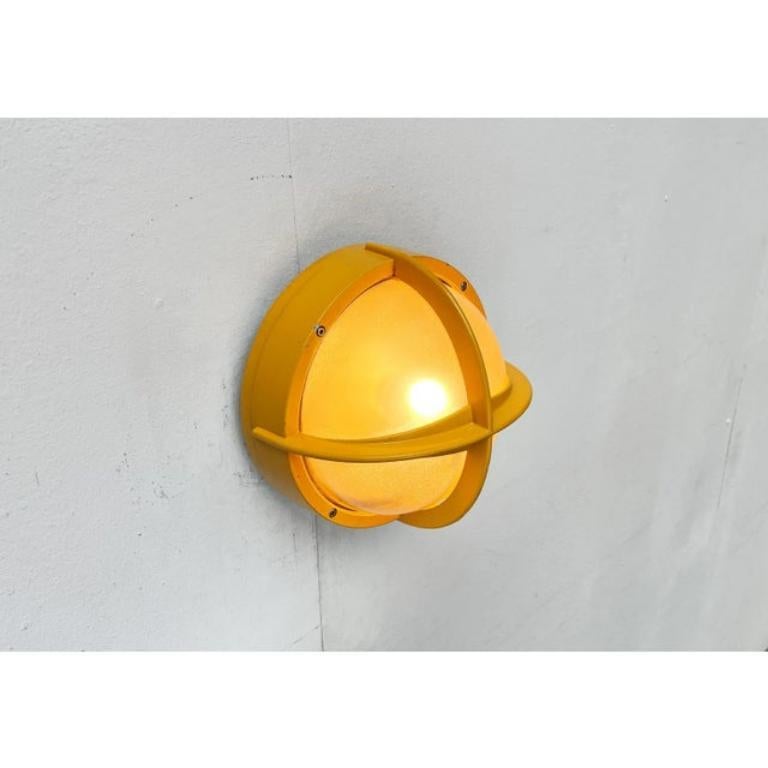 Robust Pirate outdoor wall light in a special color from the Danish manufacturer Nordisk Solar.

The Pirate is inspired by a maritime design language based on functionality. The frame grille is made of thick cast aluminum, painted yellow and serves