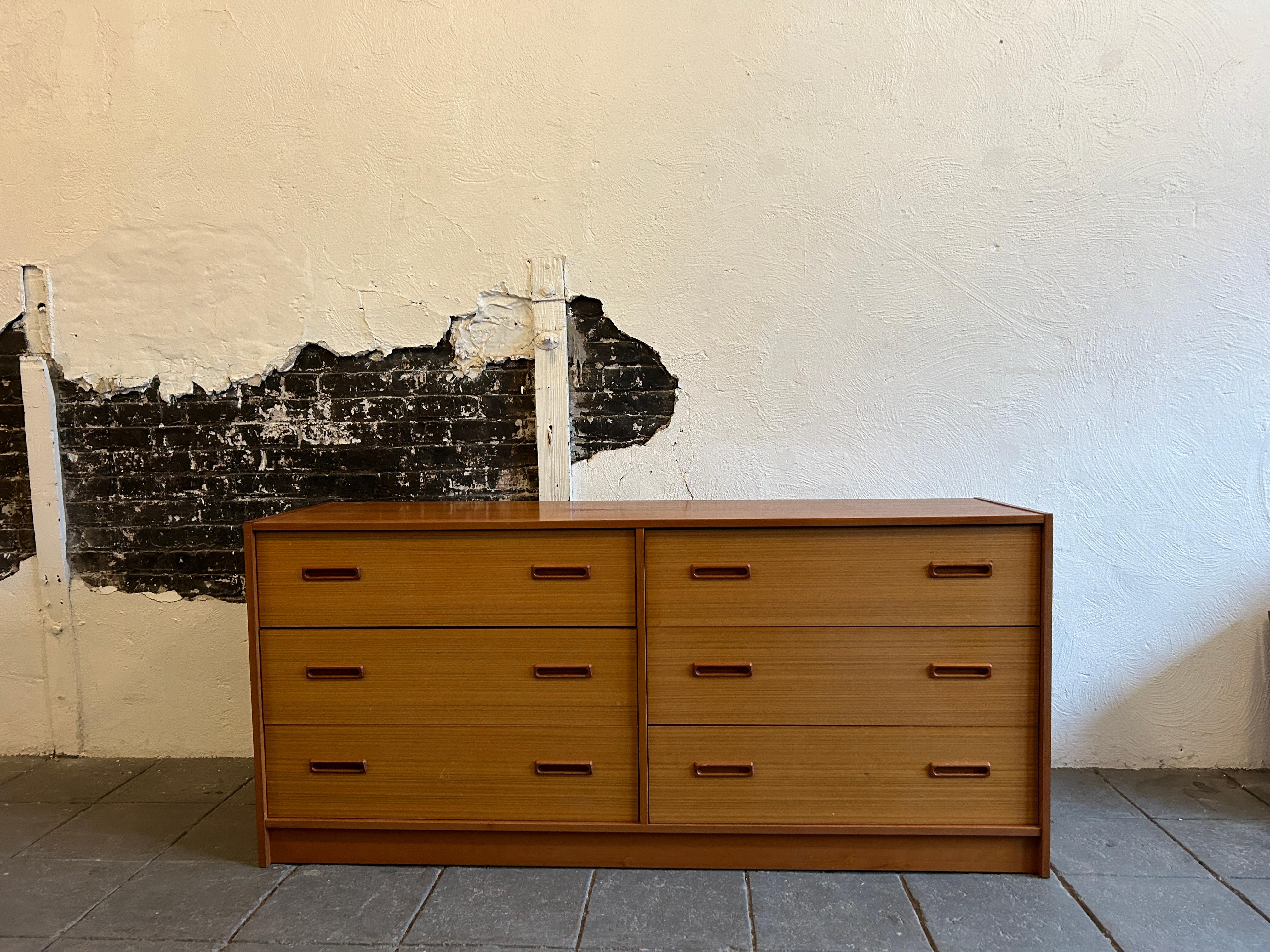 Mid century danish modern 2 tone teak 6 drawer dresser. Clean inside and out. Great Scandinavian modern dresser.

65” x 19” x 29” 