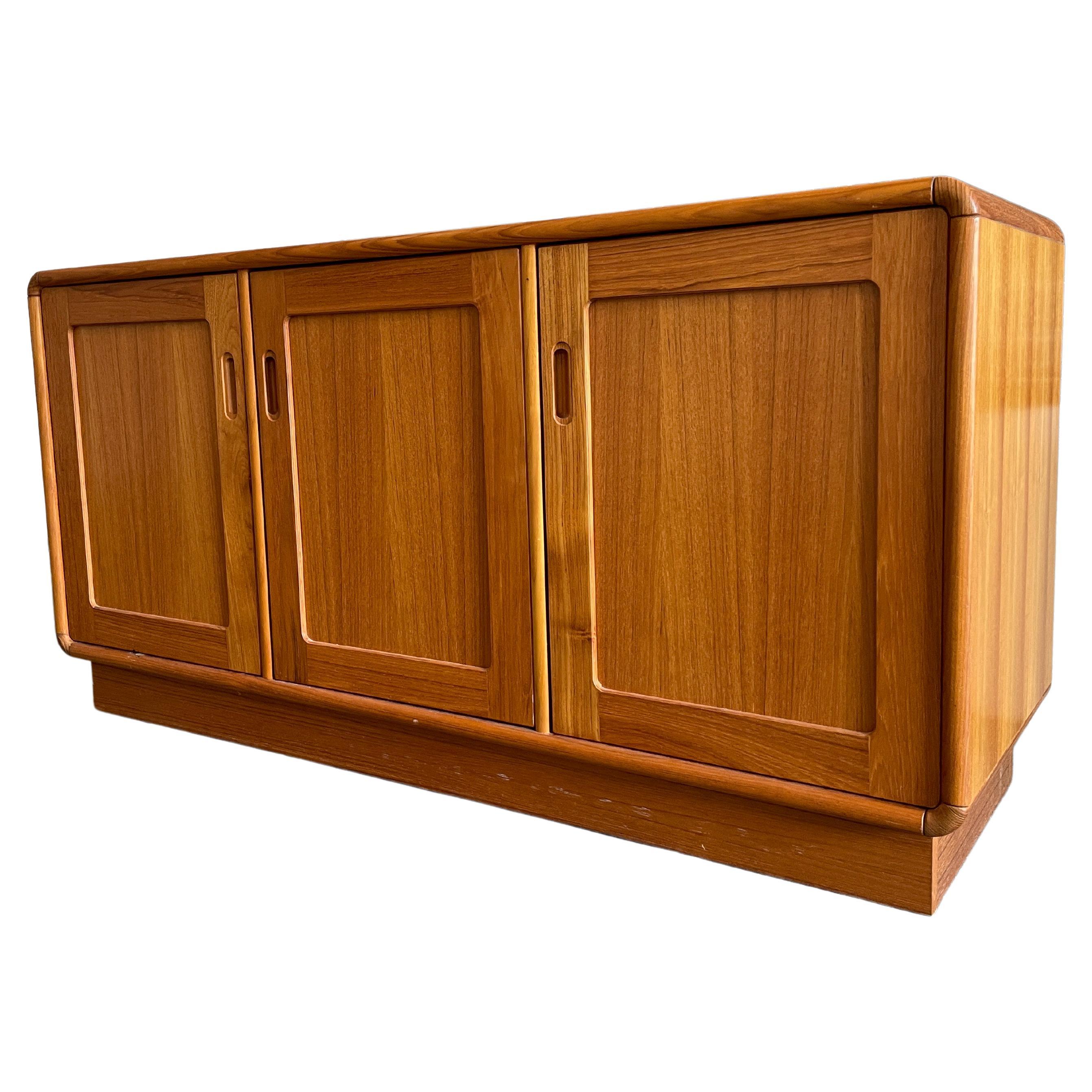 Mid century Danish modern 3 door teak credenza rounded corners has adjustable 6 shelves inside. Very clean inside and out. Beautiful design - no labels. All shelves inside are removable. Located in Brooklyn NYC.