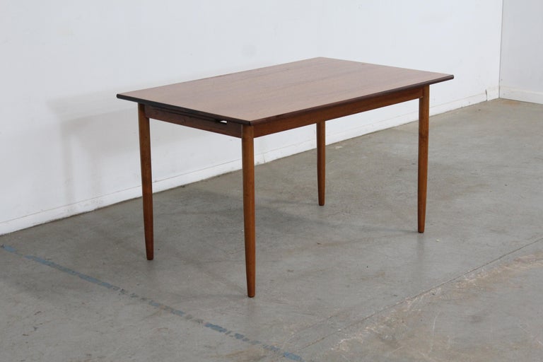 Mid-Century Danish modern teak dining table

Offered is a vintage Mid-Century Modern dining table. The table is made of teak and has 1 side Extension. It is in vintage condition showing normal age wear, including surface scratches( extension is