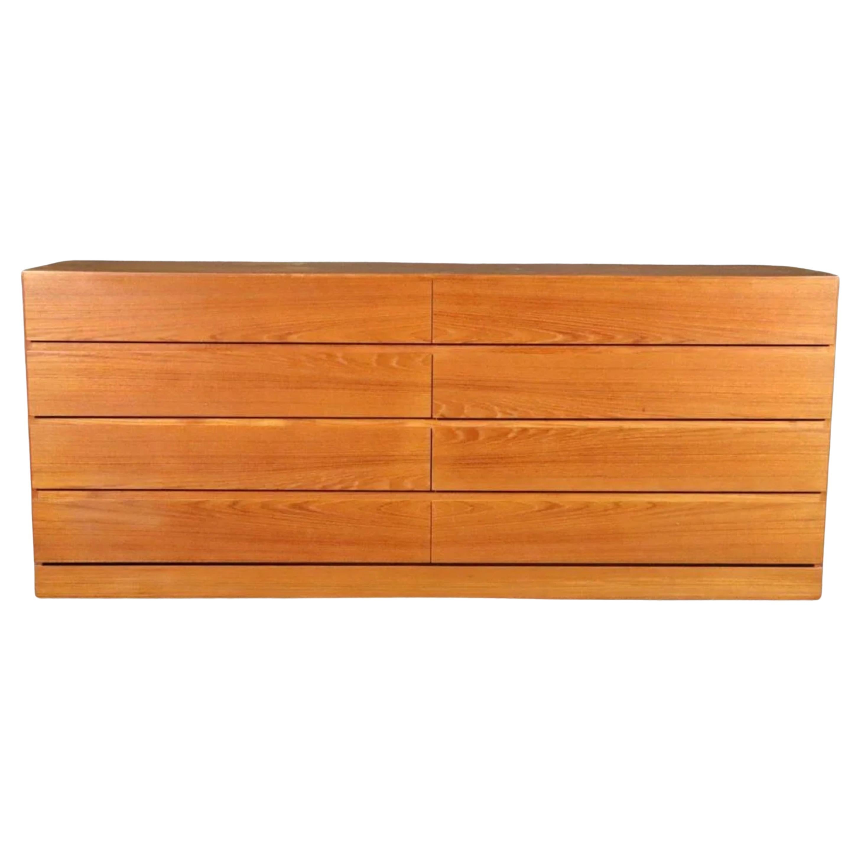 Midcentury Danish Modern 8 drawer teak dresser or credenza by Arne Wahl Iversen. Beautiful light teak color with a nice grain. All drawers clean inside and out as well as slide smooth. Simple symmetric design - good lines. Shows very little use.