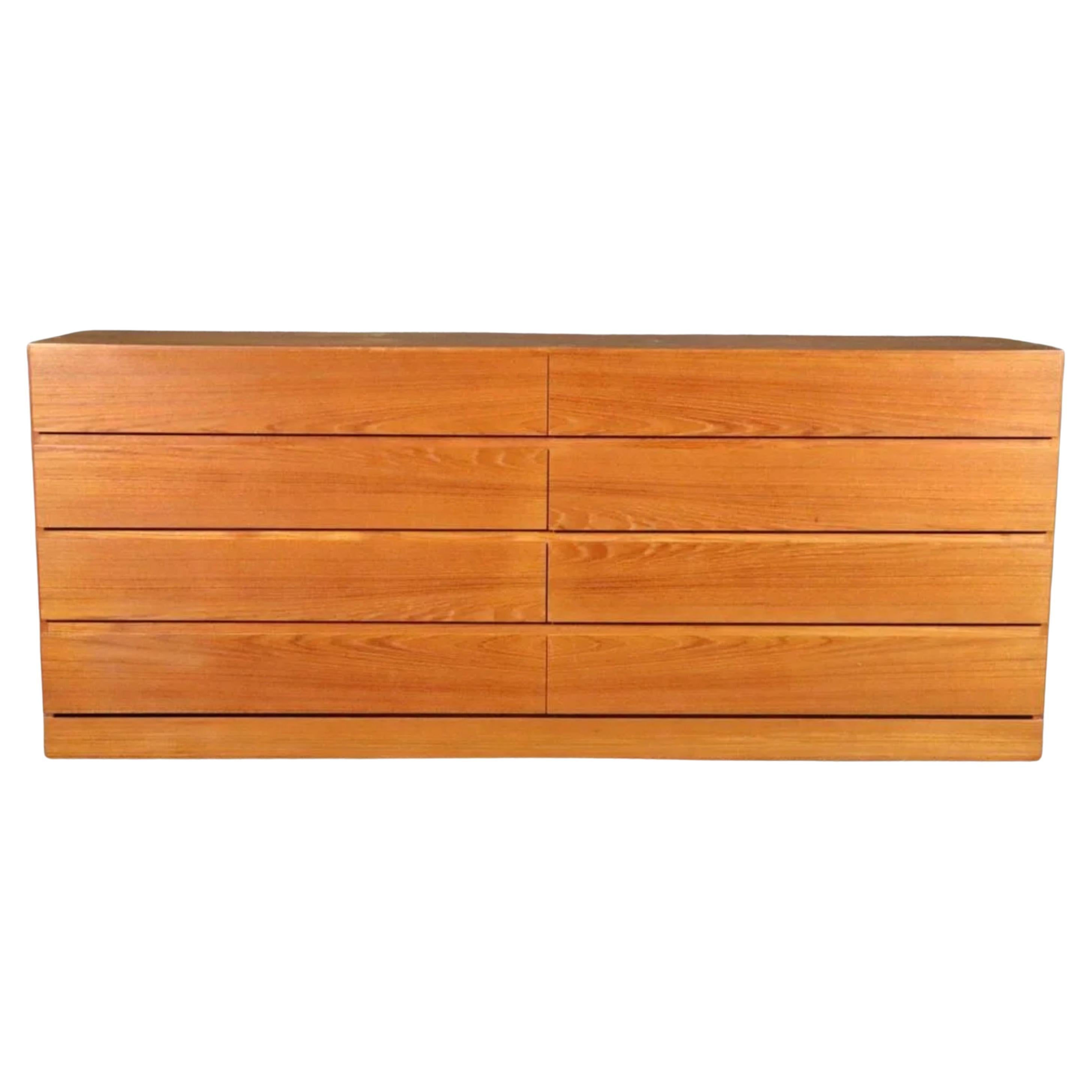 Midcentury Danish Modern 8 drawer teak dresser or credenza by Arne Wahl Iversen. Beautiful light teak color with a nice grain. All drawers clean inside and out as well as slide smooth. Simple symmetric design - good lines. Shows very little use.