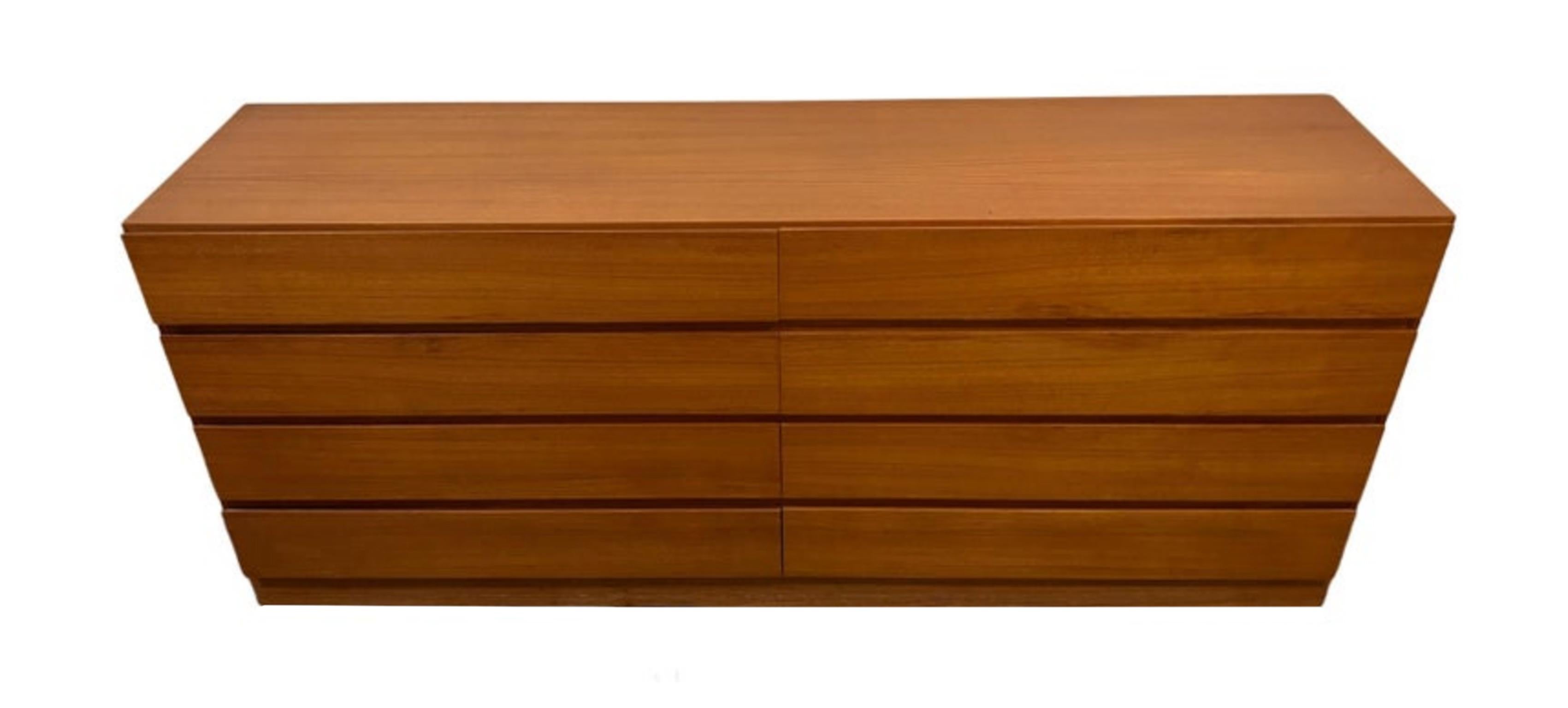 Mid century Danish Modern 8 drawer teak dresser or credenza. Beautiful light teak color with a nice grain. All drawers clean inside and out as well as slide smooth. Simple symmetric design - good lines.. Shows very little use. Made In Denmark.
