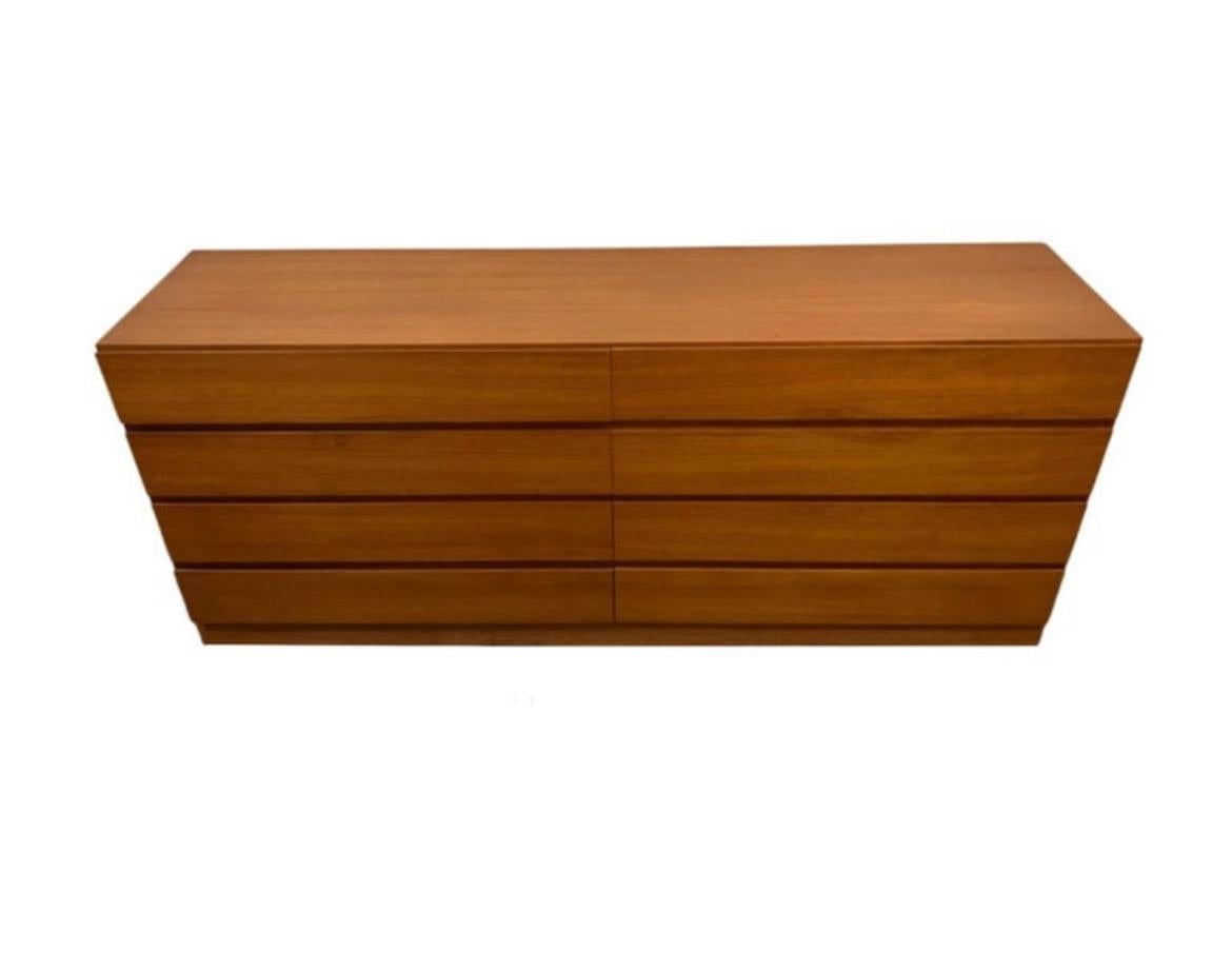 Mid century Danish Modern 8 drawer teak dresser or credenza by Arne Wahl Iversen. Beautiful light teak color with a nice grain. All drawers clean inside and out as well as slide smooth. Simple symmetric design - good lines.. Shows very little use.