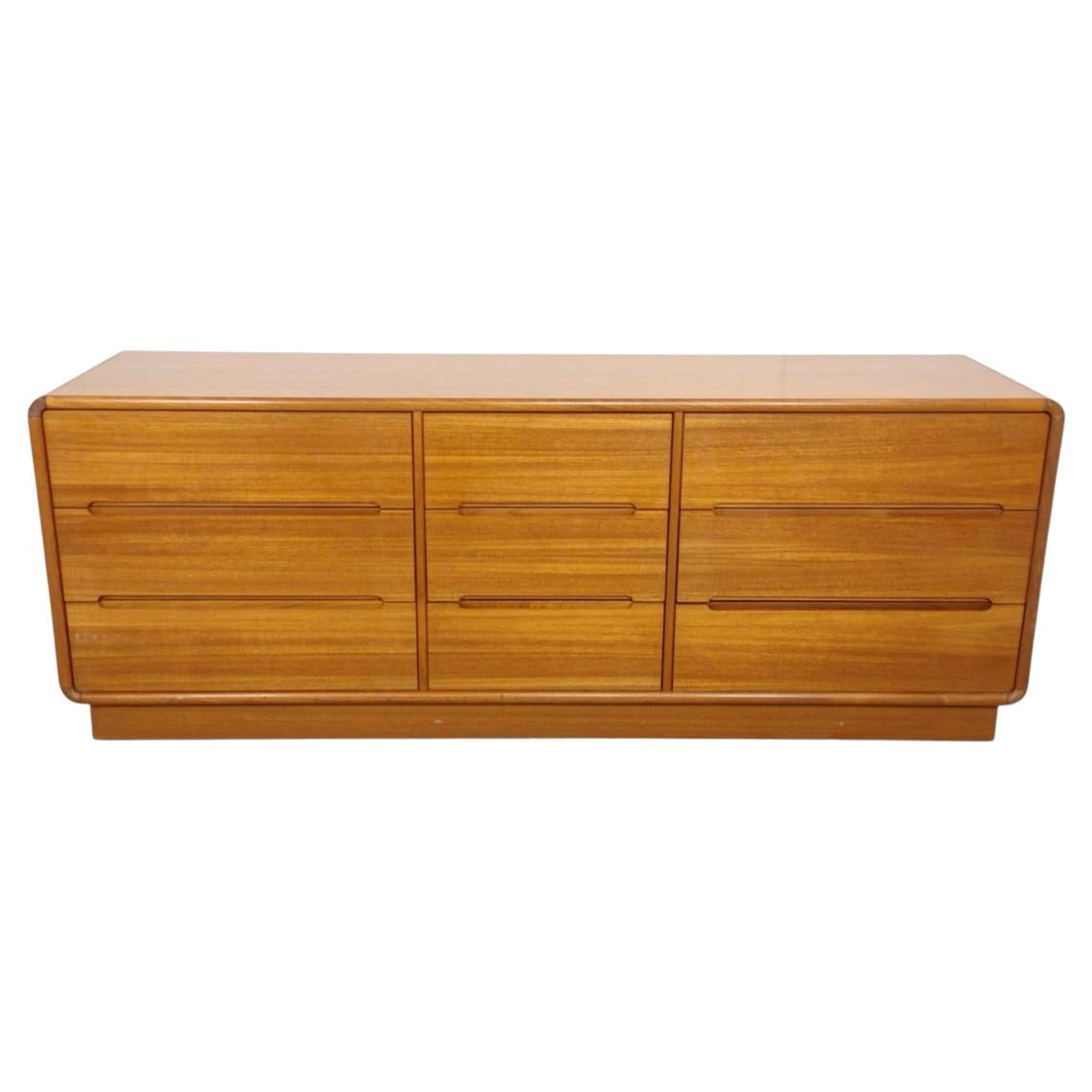 Mid century Danish modern 9 drawer teak dresser or credenza rounded corners. Very clean inside and out. Beautiful design - no labels - Back of this Dresser is finished. All drawers slide smooth. Made in Denmark. Located in Brooklyn NYC.

Measures: