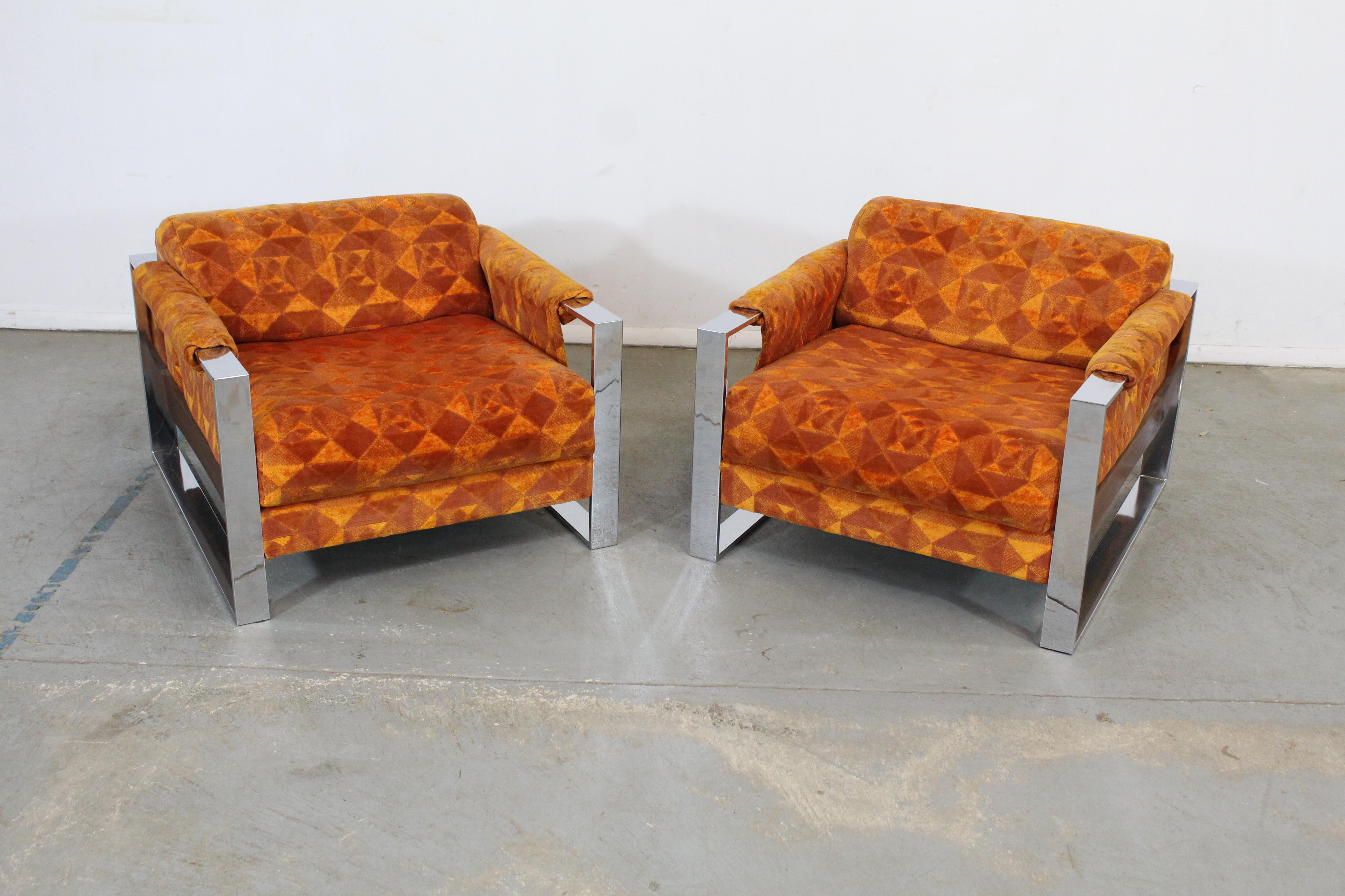 Offered is a rare pair of Mid-Century Modern adrian pearsall craft associates chrome lounge chairs. These chairs feature geometric orange upholstery and chrome bases. They are in excellent condition, showing minor age wear (upholstery in good