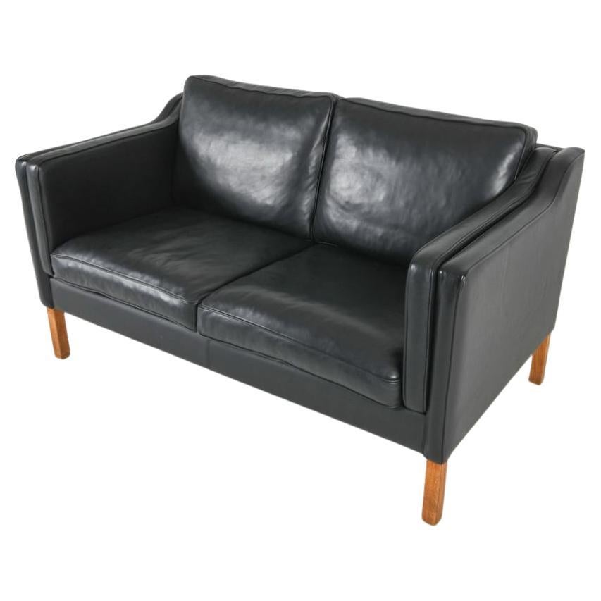 Midcentury Danish modern beautiful Black leather 2 seat sofa oak legs. Style of Børge Mogensen. Beautiful black leather is soft and shows no signs of use but broken in nicely. Great small Danish Modern sofa original like new - Great condition. Sofa