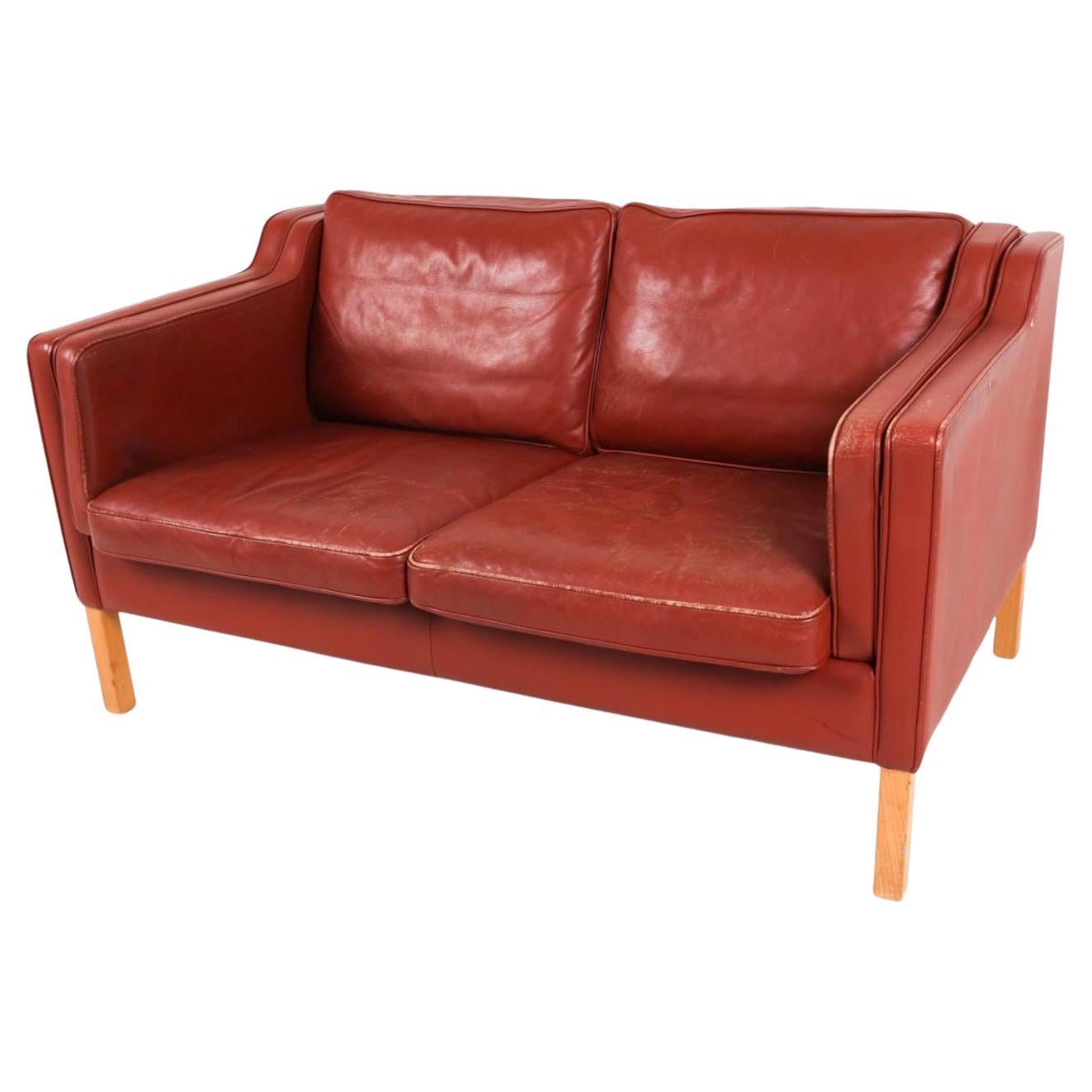 Midcentury Danish modern beautiful dark Red blue leather 2 seat sofa birch legs. Style of Børge Mogensen. Beautiful Dark Red leather is soft and shows signs of use but broken in nicely. Great small Danish Modern sofa has original down filled