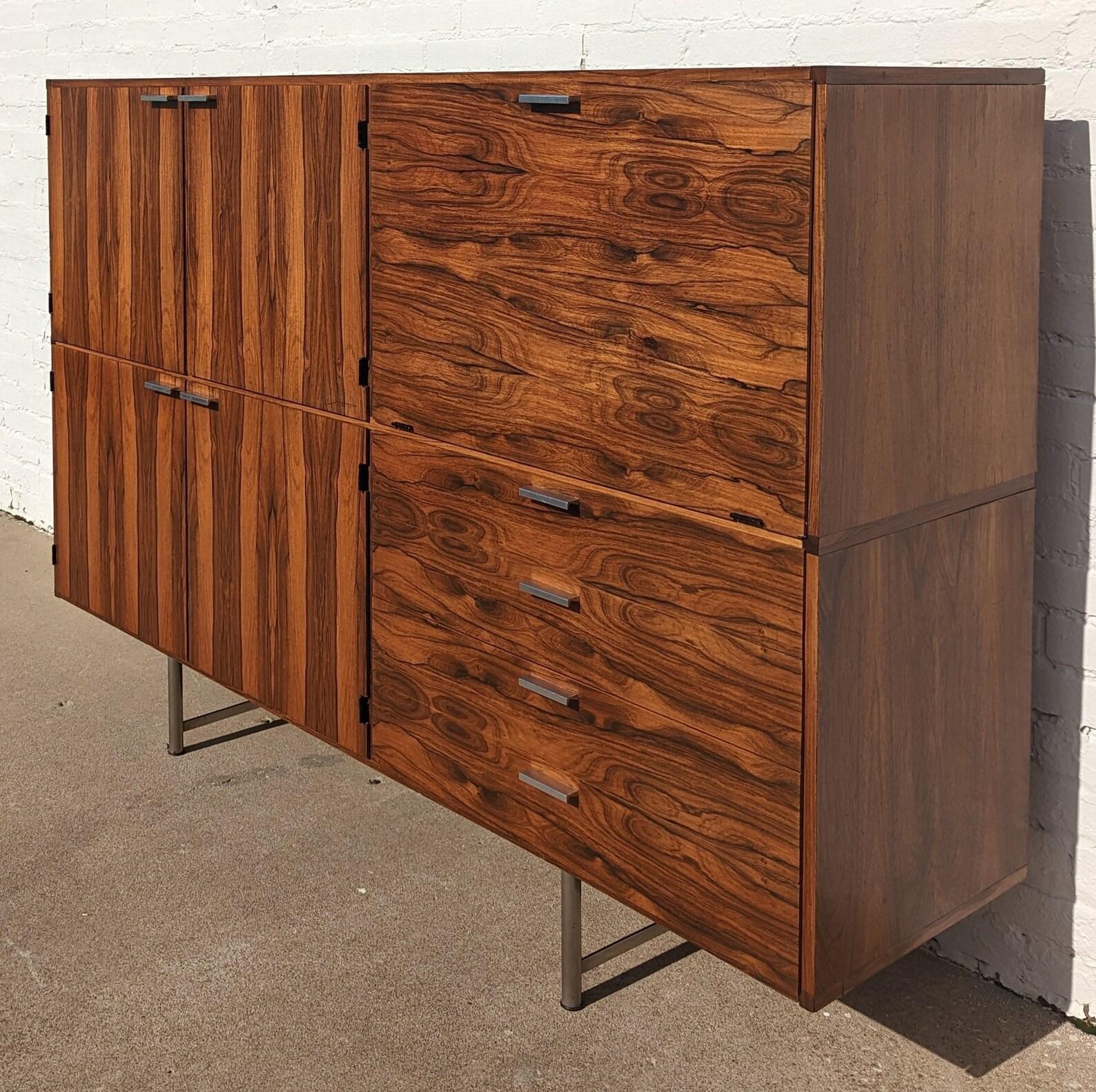Mid Century Danish Modern Cees Braakman Cabinet

Above average vintage condition and structurally sound. Has some expected slight finish wear and scratching. Has a couple veneer chips on door edges. Several small holes have been drilled in back