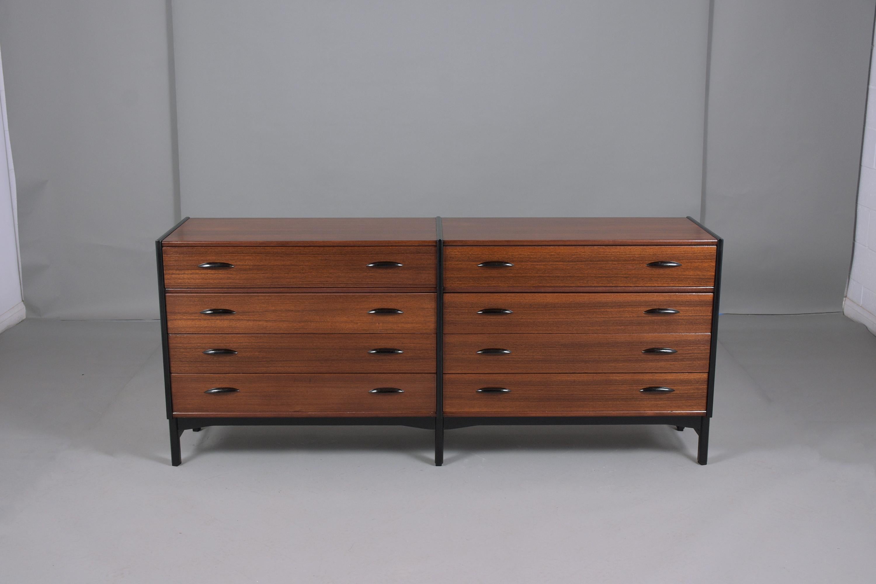Exceptional vintage 1960S Danish chest of drawers hand-crafted out of mahogany wood fully restored by our craftsman professional team. This double dresser has been newly stained in rich mahogany color with ebonized combination details. Has eight