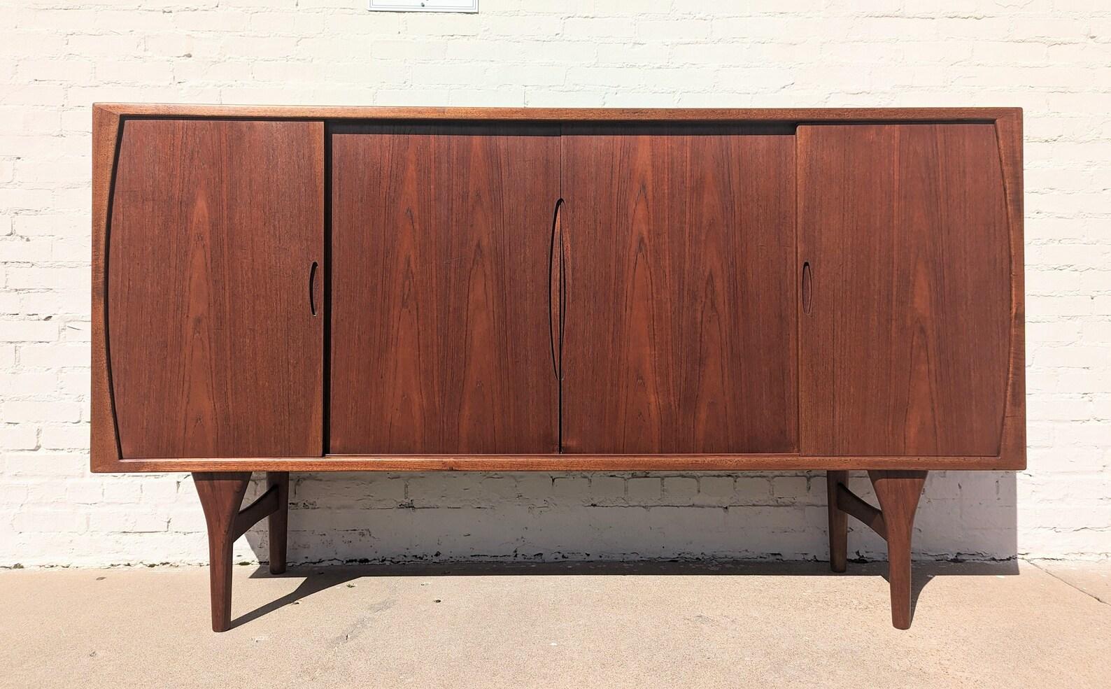 Mid Century Danish Modern Cocktail Cabinet for Bruno Hansen
 
Above average vintage condition and structurally sound. Has some expected slight finish wear and scratching. Top, trim and doors have been refinished but still have some scratching and