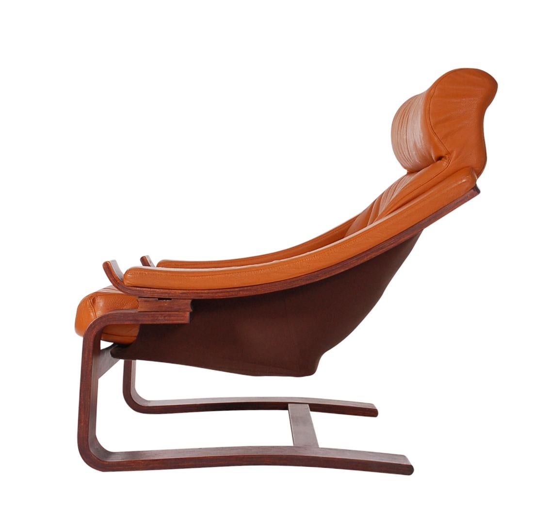 A sleek modern design from the 1970s and made in Denmark. The chair features solid wood construction and cognac leather upholstery. Very comfortable. In the style of Percival Lafer.