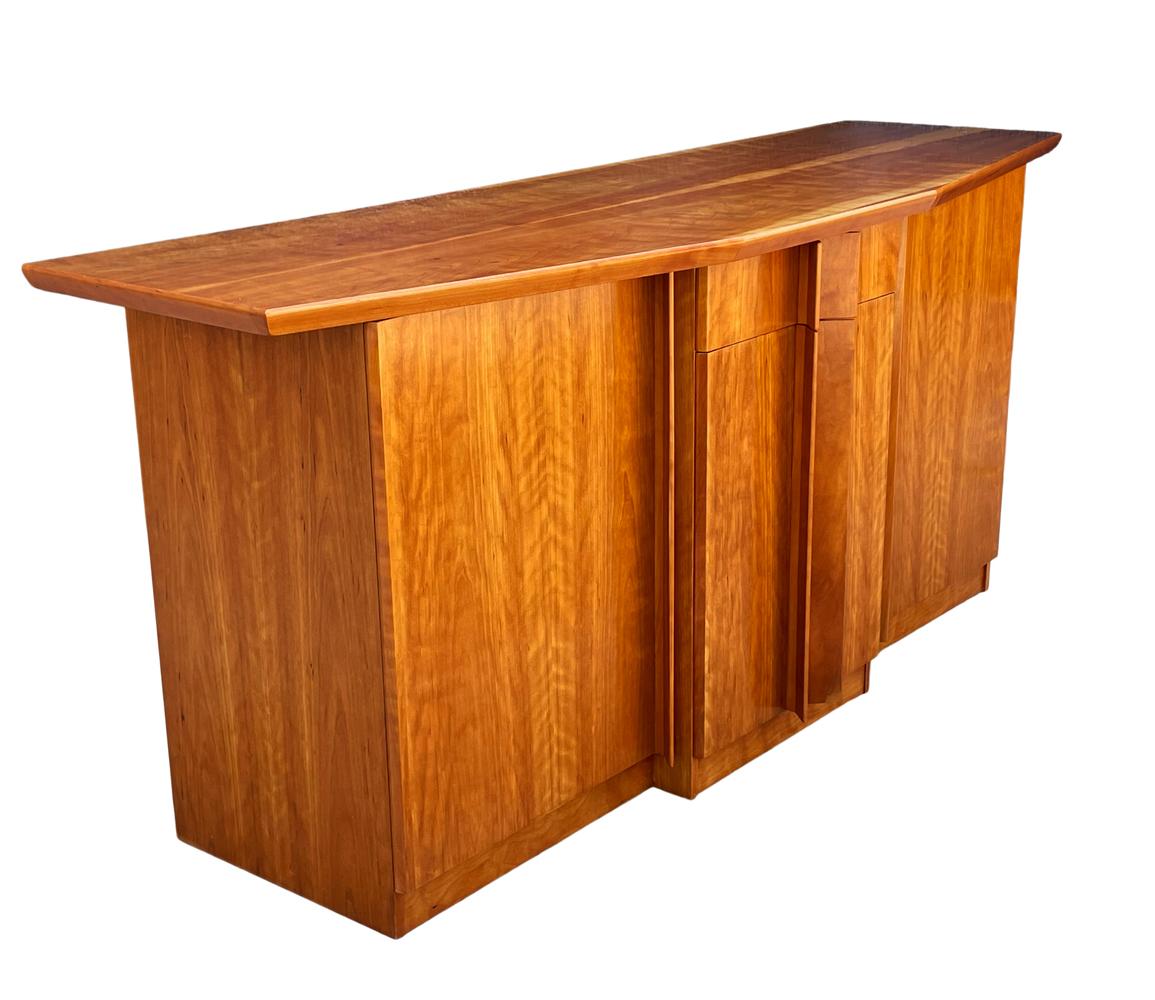 A funky sideboard cabinet from Denmark circa 1990's. It features beautiful light cherry construction. Nice clean condition.