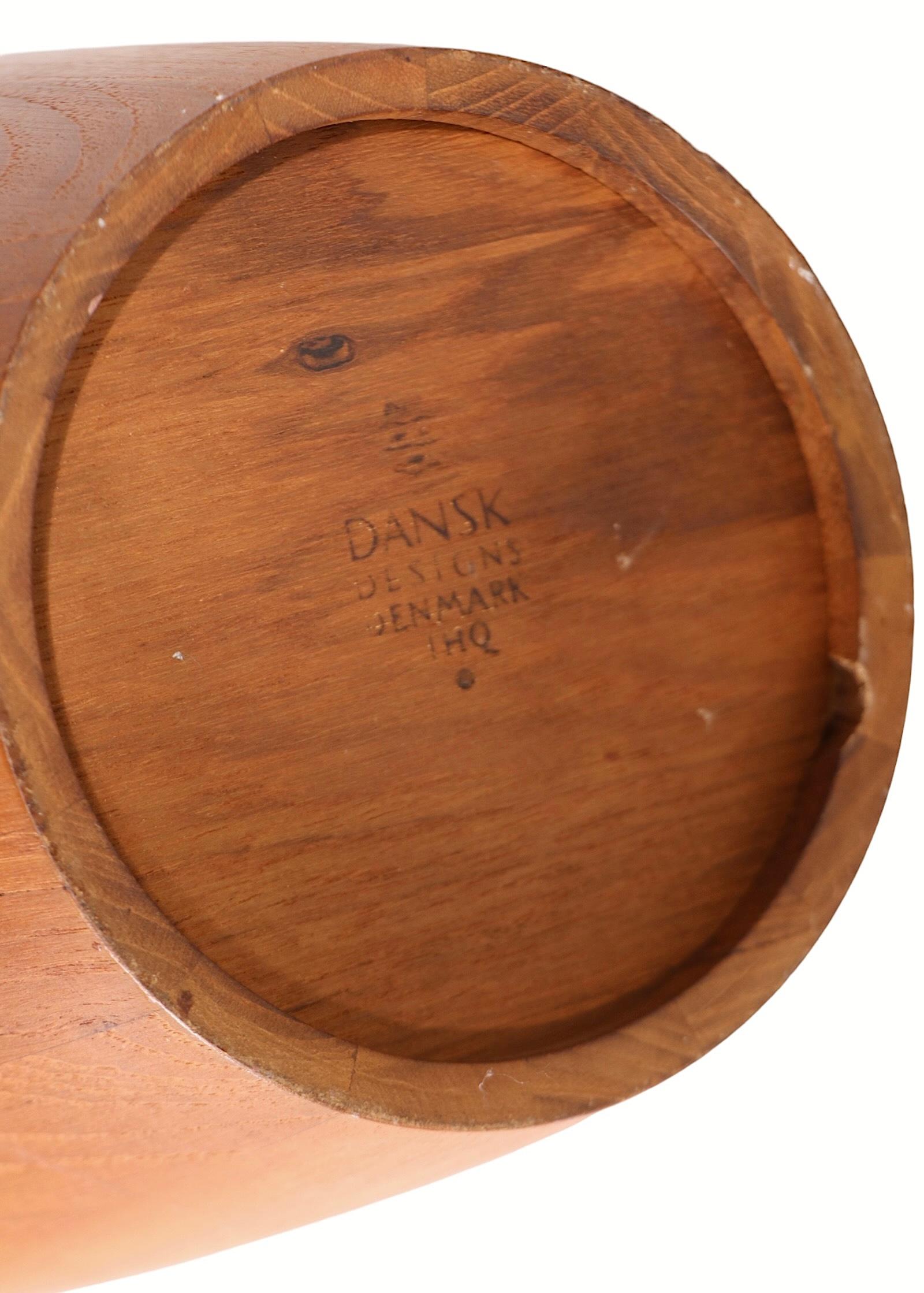 Exceptional Dansk Congo model teak ice bucket designed by Jens Quistgaard, for Dansk, c. 1950's. This is the hard to find large model ( 19 in. H ) with the early orange plastic liner. This example is in very good, original, clean and ready to use