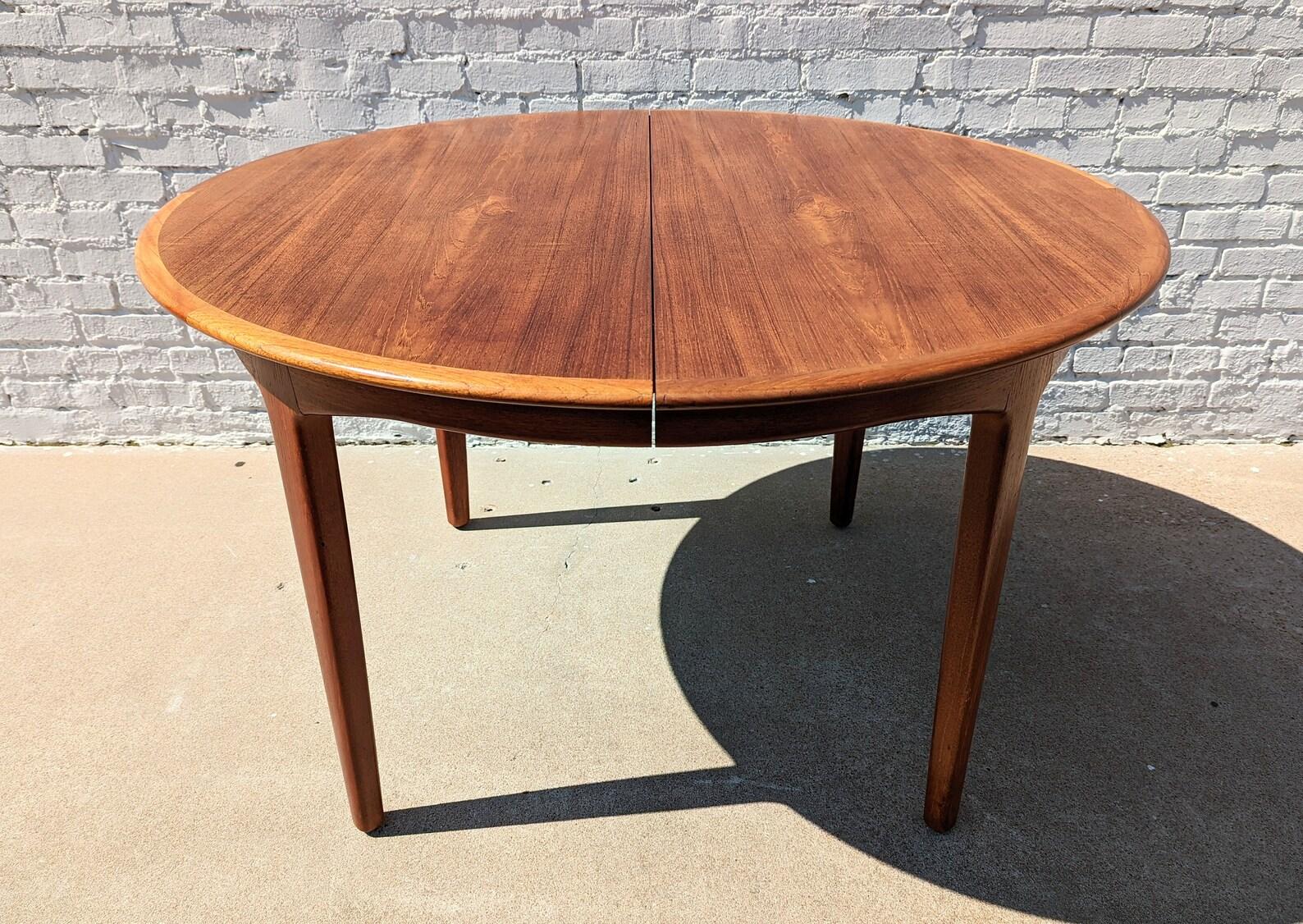 Mid Century Danish Modern Dining Table by Moller
 
Above average vintage condition and structurally sound. Has some expected slight finish wear and scratching. Top has been refinished at some point and does not have original factory finish. Top has