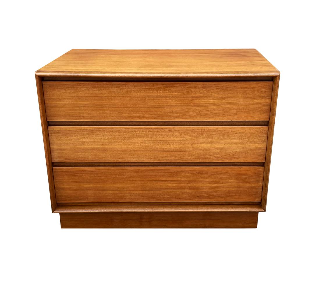 A clean sleek modern design from the 1960's and possibly from Scandinavia. It features beautiful grained wood with 3 deep drawers. A piece to use in any room of the house.