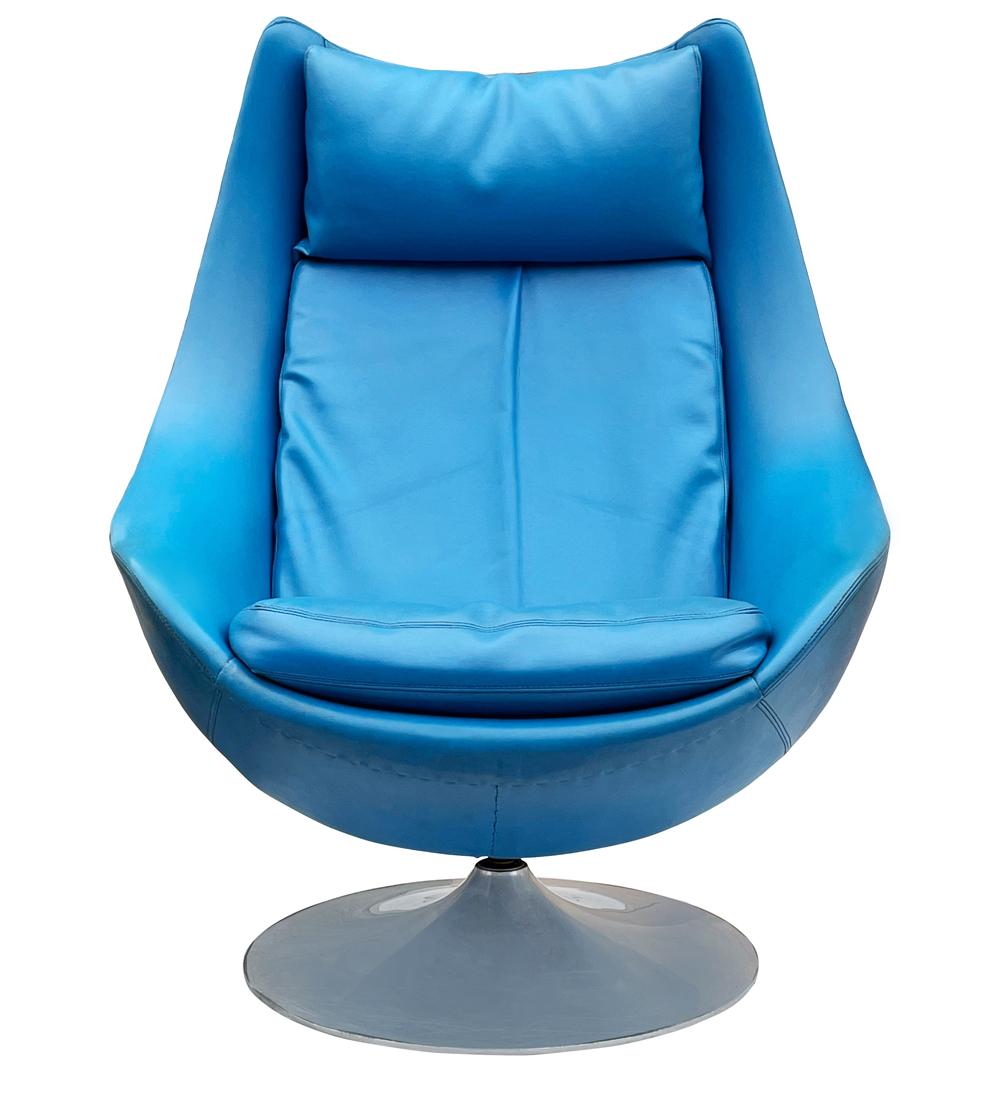 A Danish classic designed by H.W Klein and produced by Bramin Mobler in the 1960's. It features the original blue naugahyde upholstery with a tulip swiveling base. Manufacturer label.