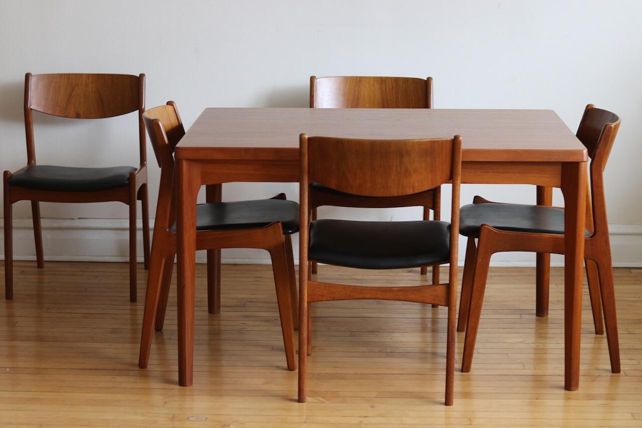 Mid-Century Modern Danish teak wood expanding dining table and 5 chairs.
Just imported from Denmark.
Dining Table designed by Henning Kaerjnulf for Vejle Stole & Møbelfabrik.
Dining chairs designed by P.E Jørgensen for Farsø
